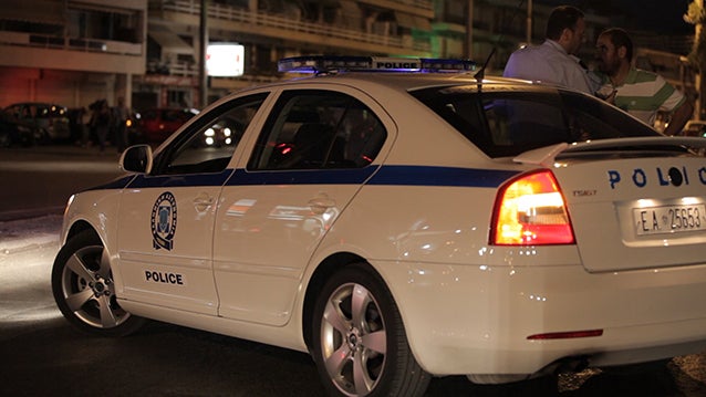 A police car on the side of the road in Athens. 