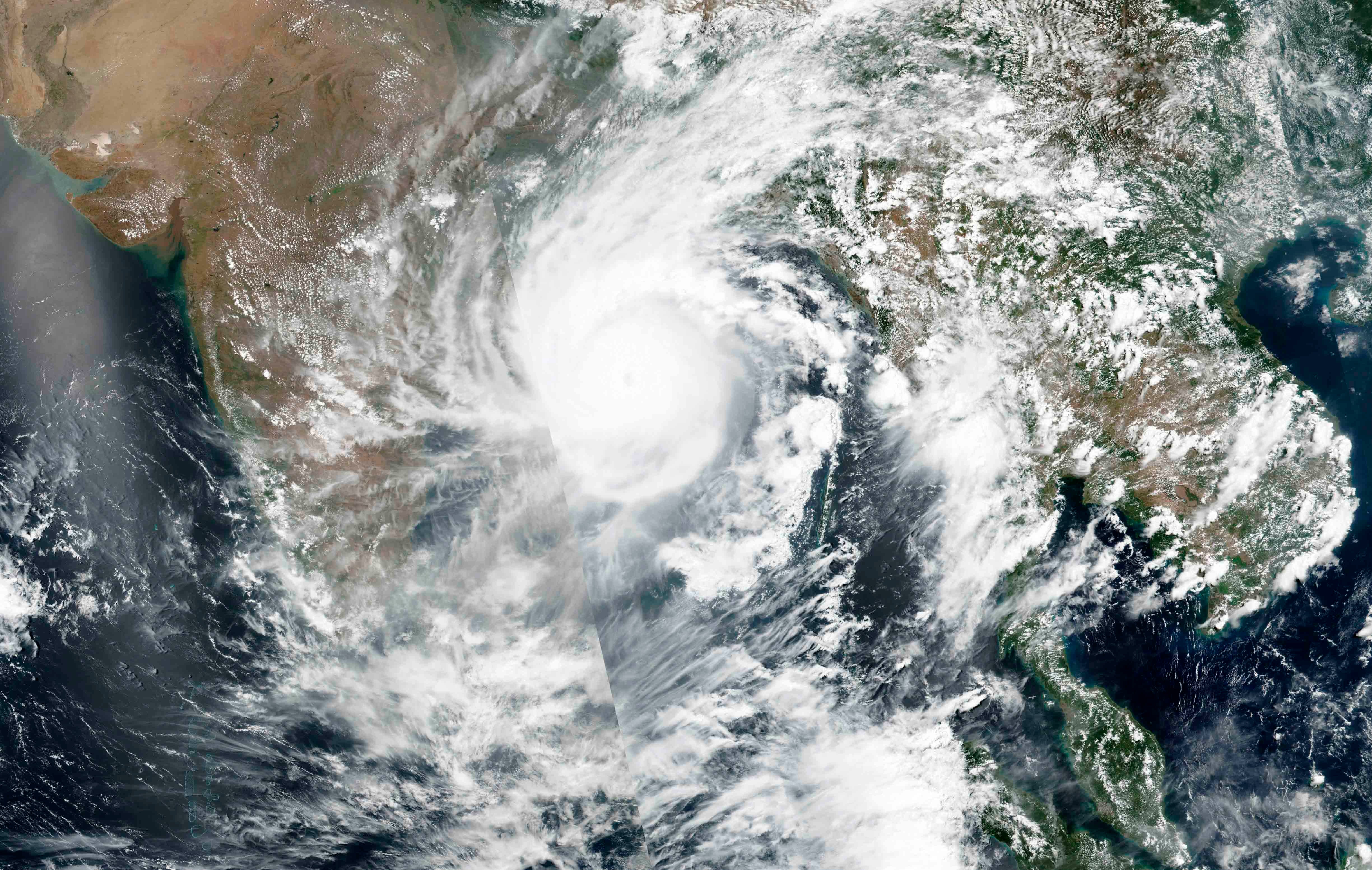 NASA satellite imagery shows Cyclone Amphan over the Bay of Bengal in India, May 19, 2020, which made landfall on Bhasan Char May 20, 2020.  © 2020 NASA Worldview, Earth Observing System Data and Information System (EOSDIS) via AP