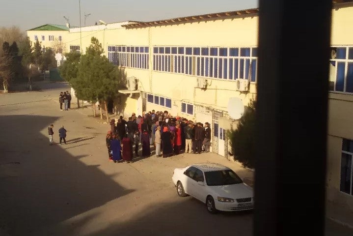 People crowd a state store in Ashgabat.