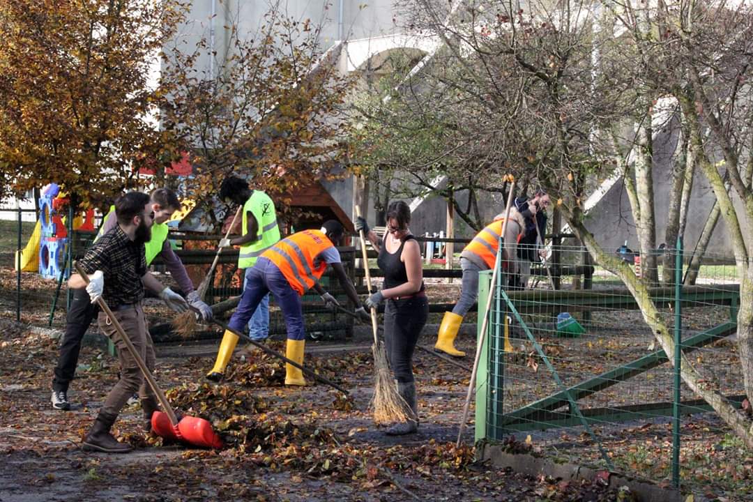 Italians and asylum seekers from the local specialized reception center work together to clear debris after floods in Belluno, Italy, November 2018. 