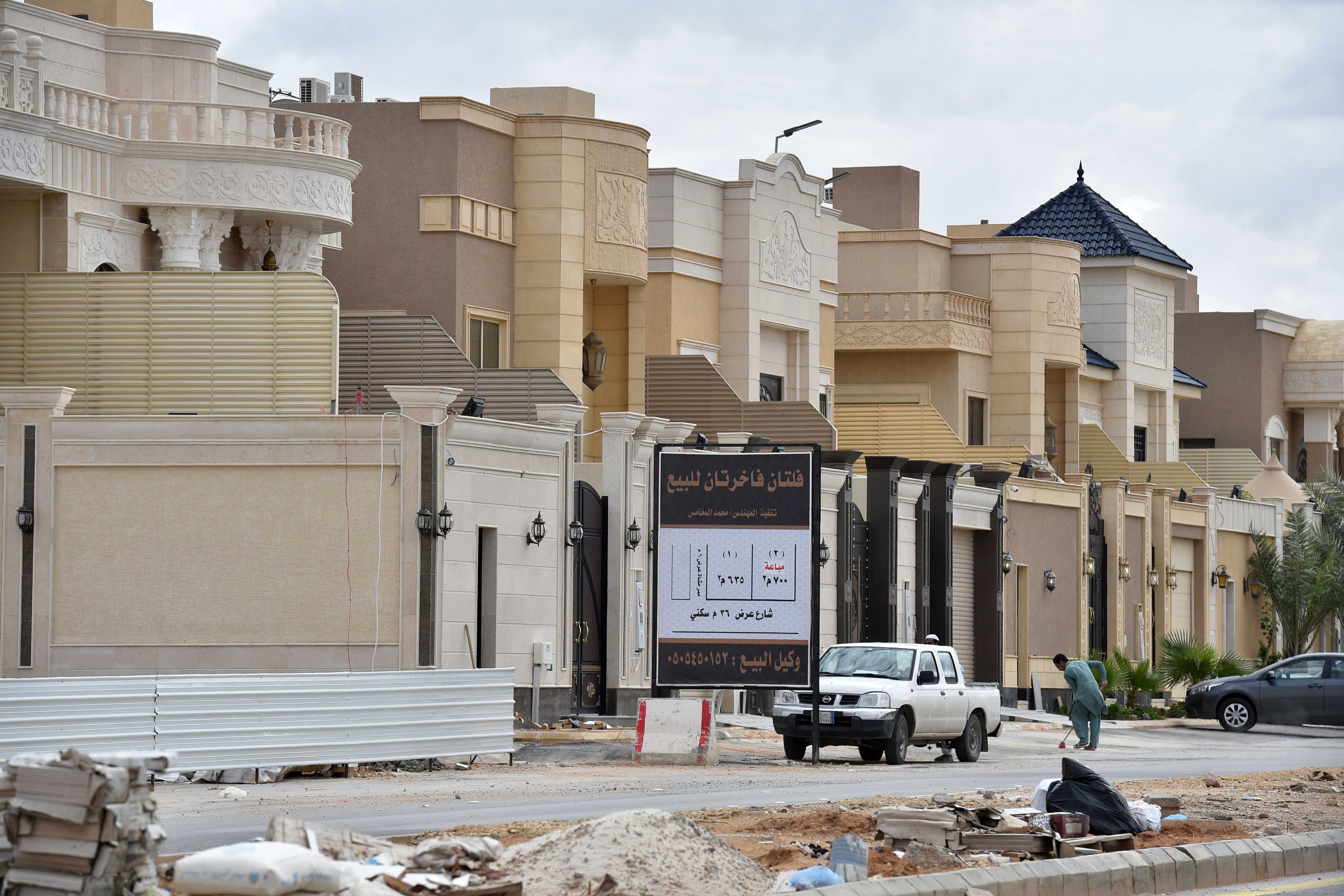 Foreign laborers work on the construction of new luxury houses in the Saudi capital, Riyadh, April 2019.