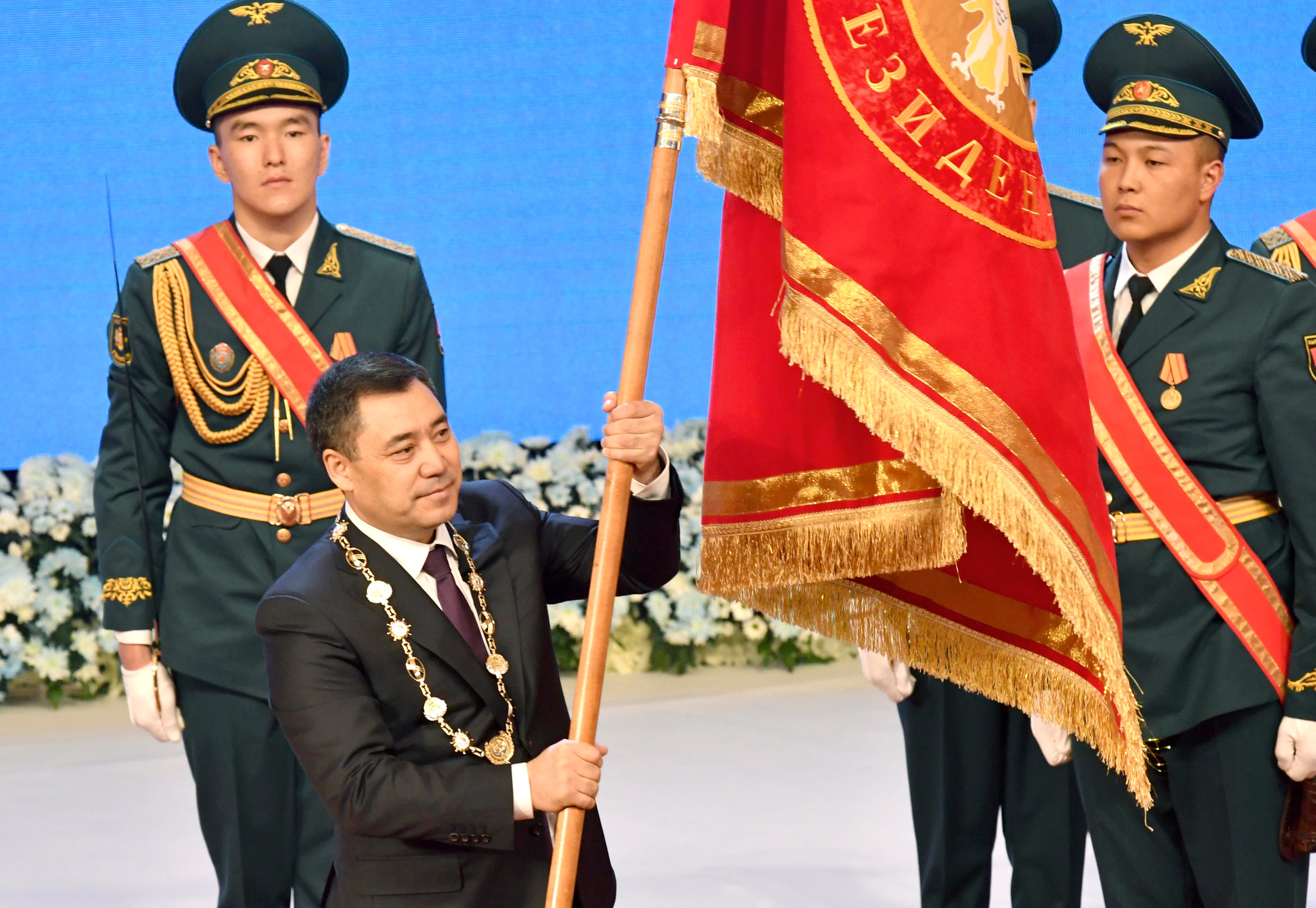 Kyrgyzstan President Sadyr Zhaparov holds presidential standard during his inauguration ceremony in Bishkek, Kyrgyzstan.