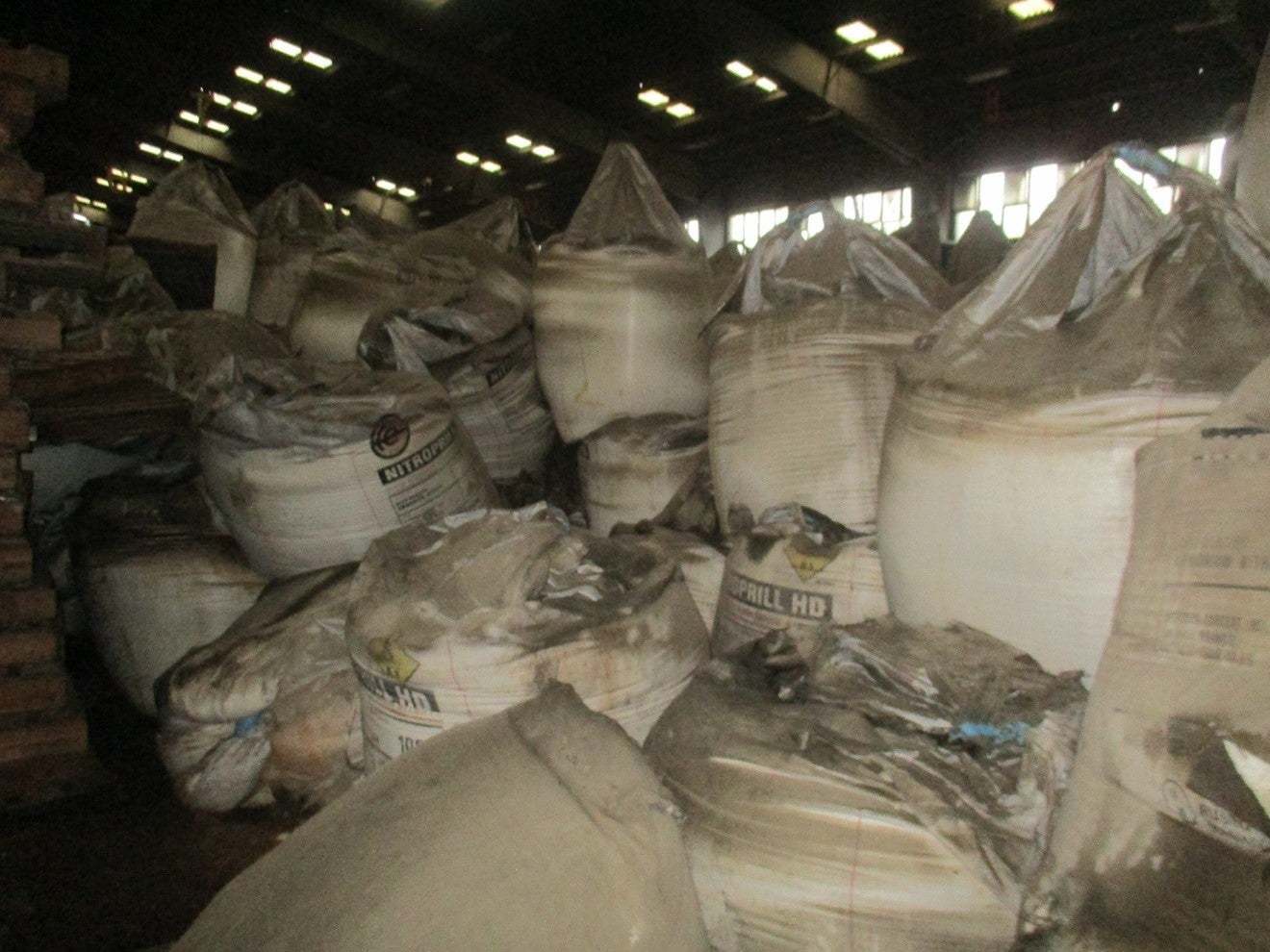 stacks of bags labeled ammonium nitrate