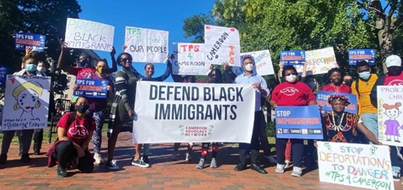 A group of protesters holding signs