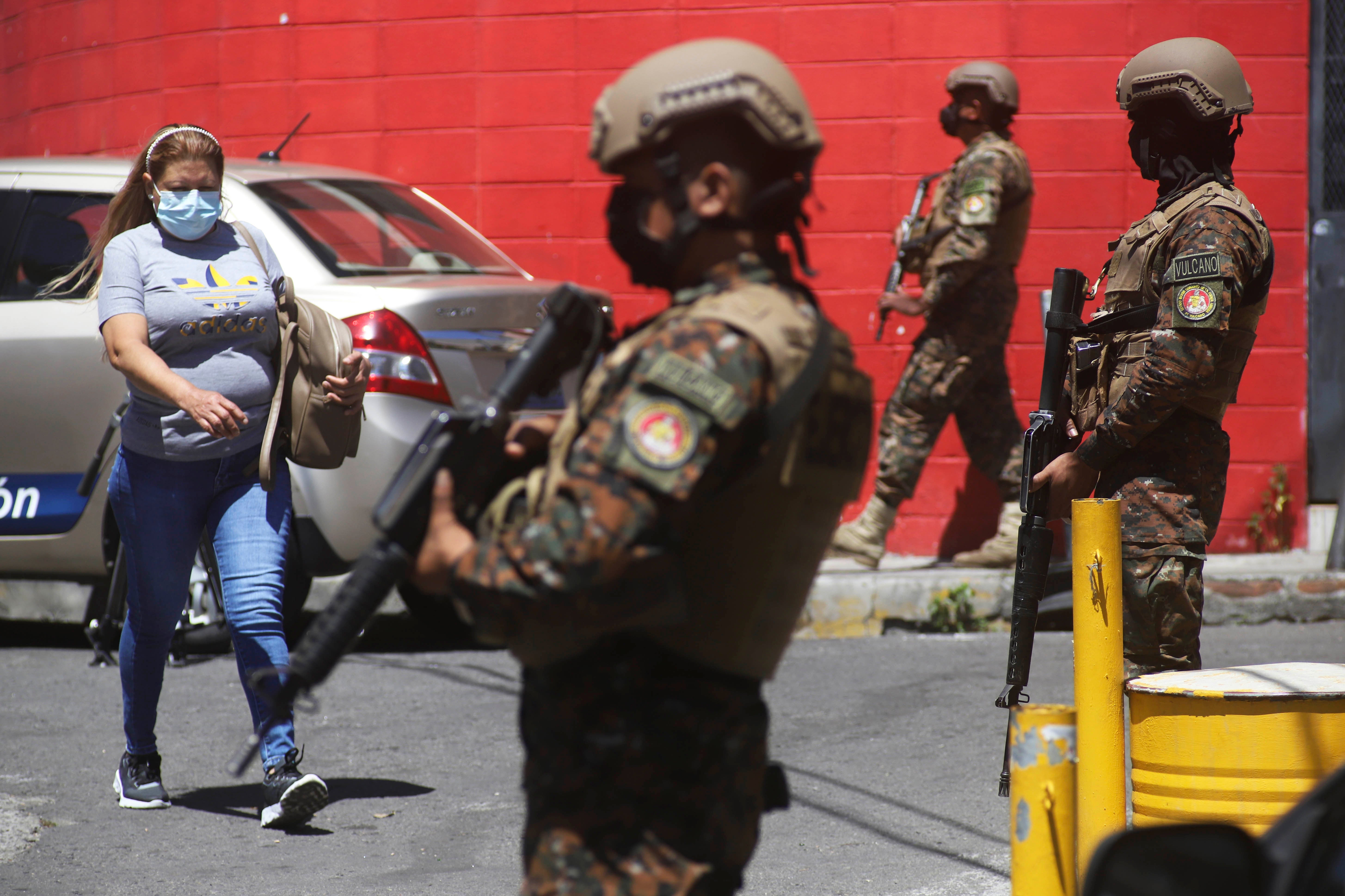 Soldiers guard a checkpoint at the entrance of the Las Palmas Community, in San Salvador, El Salvador, March 27, 2022.