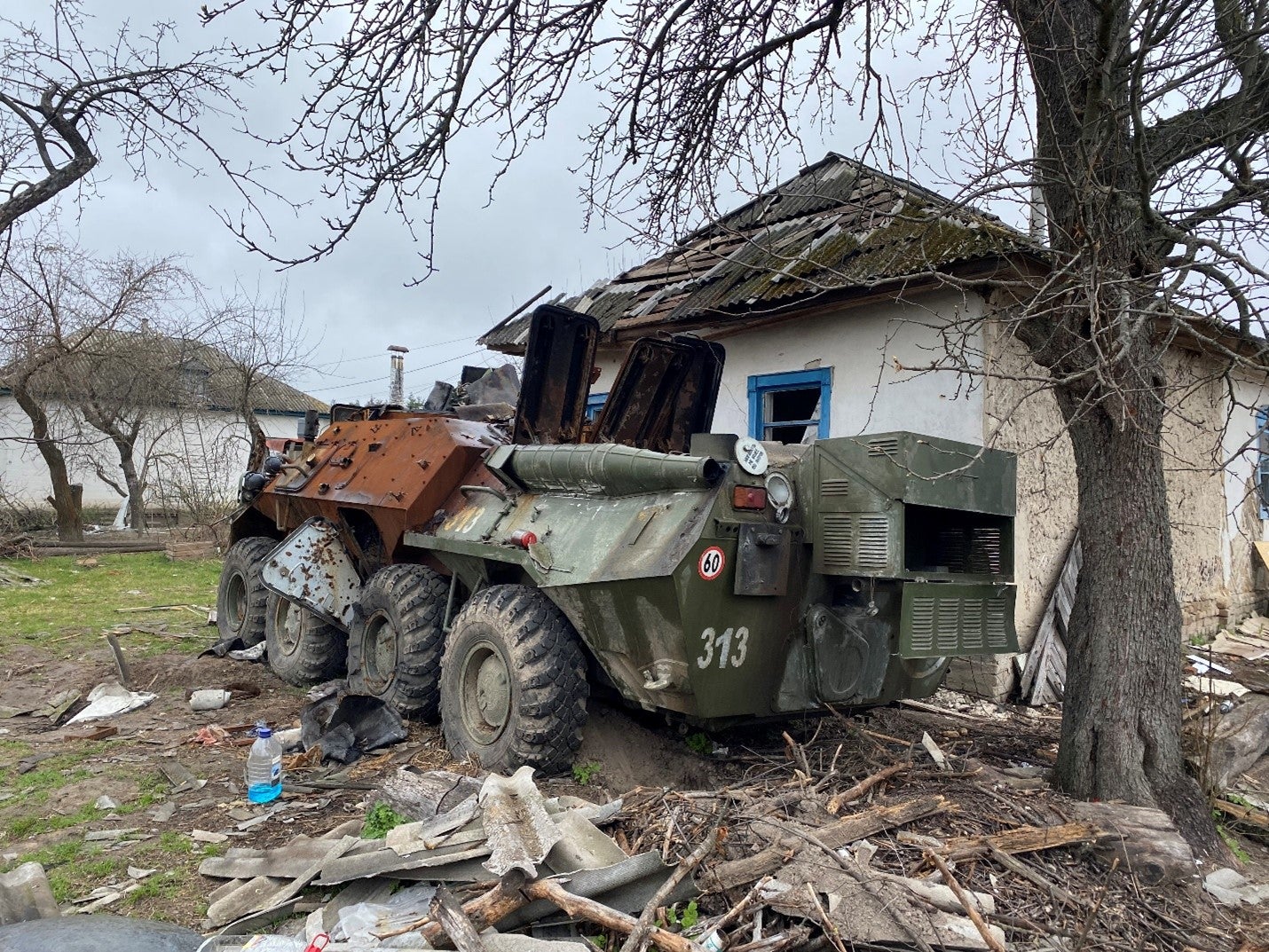 An abandoned Russian armored vehicle parked next to a home in Yahidne village, April 17, 2022. 