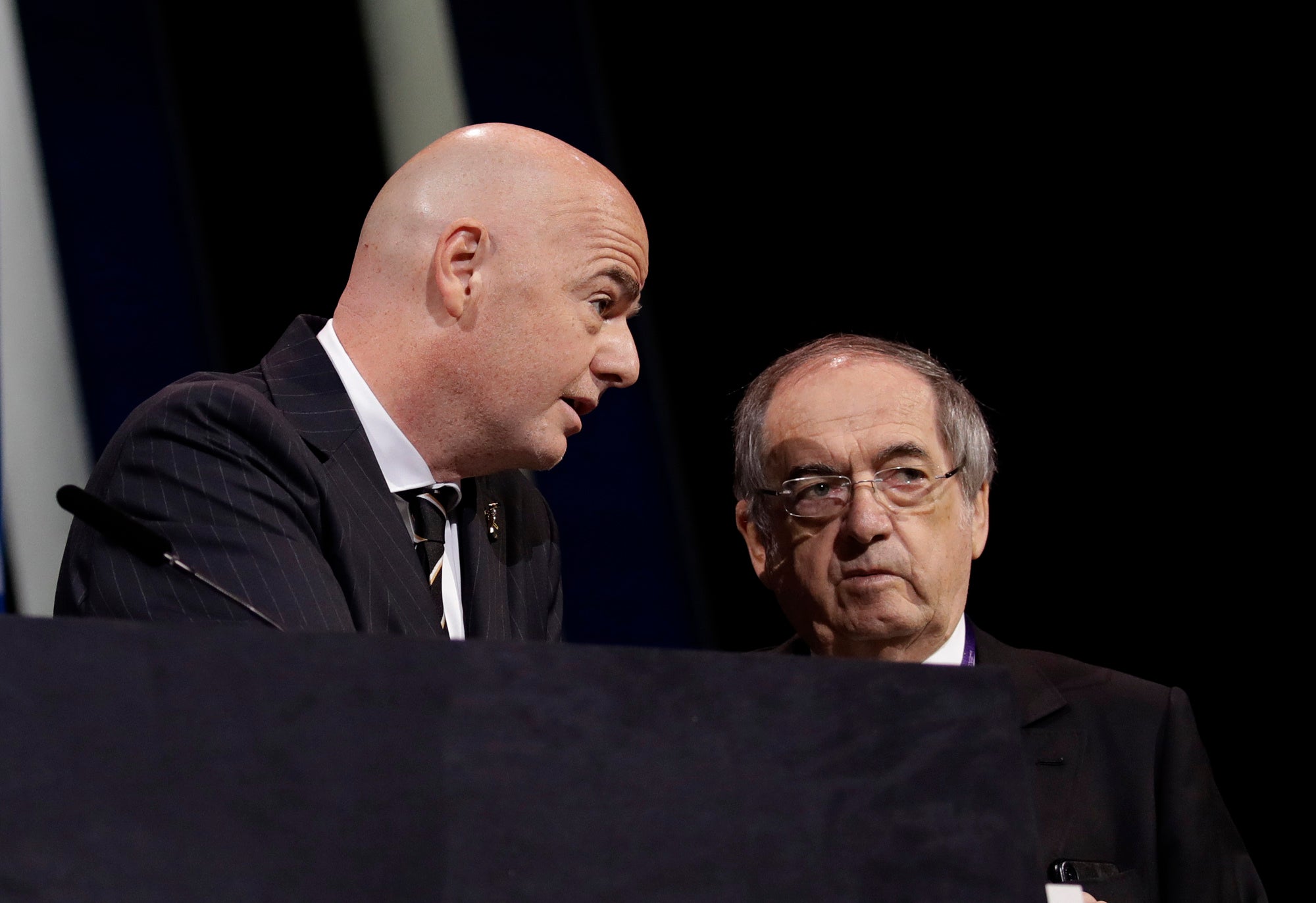 FIFA President Gianni Infantino, left, speaks with French Football Federation President Noel Le Graet