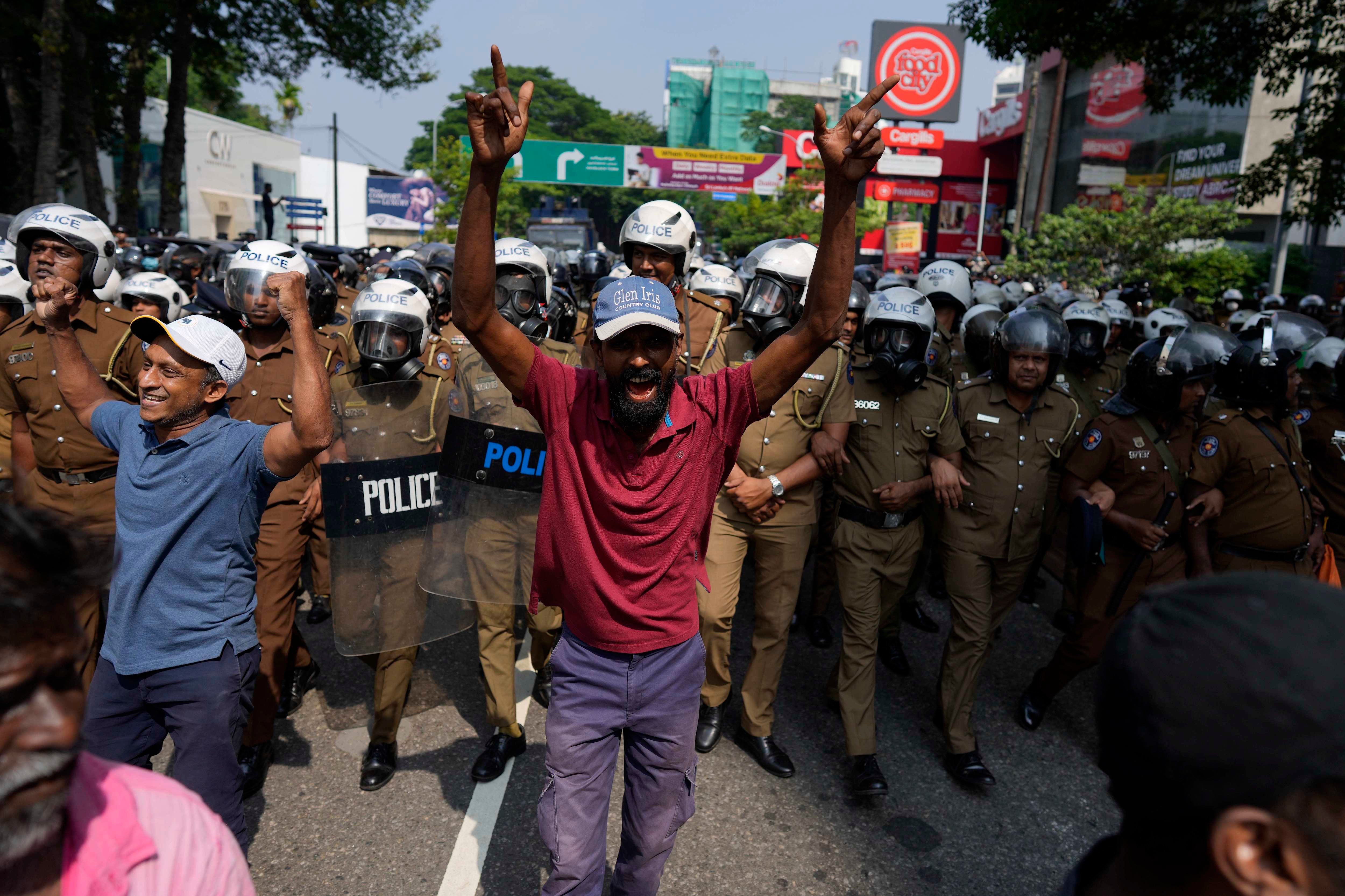 A protestor shouts against the detention of two student leaders in Sri Lanka.