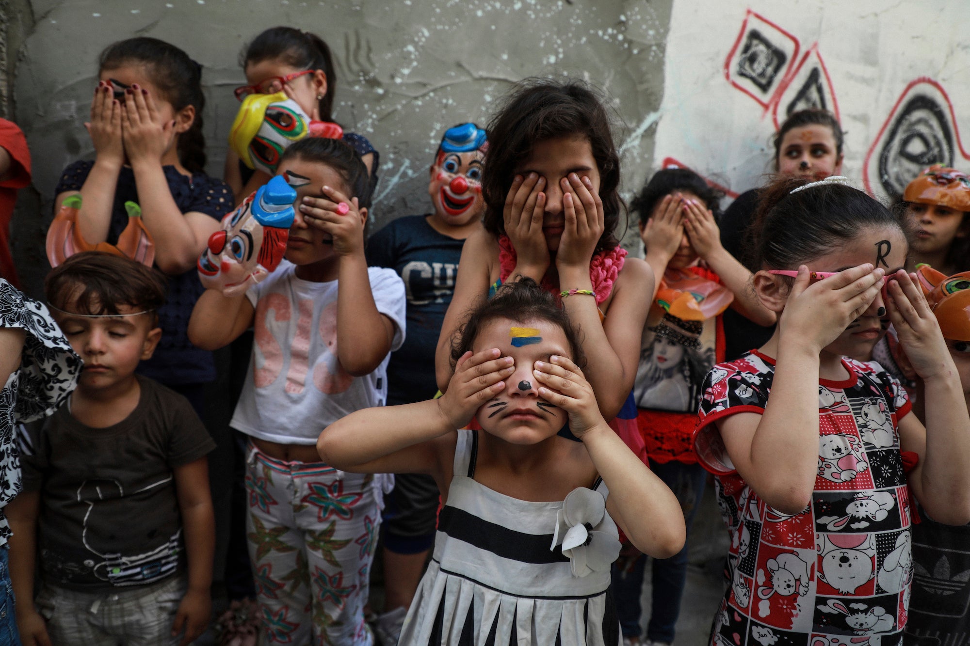Palestinian children participate in a mental health support session.