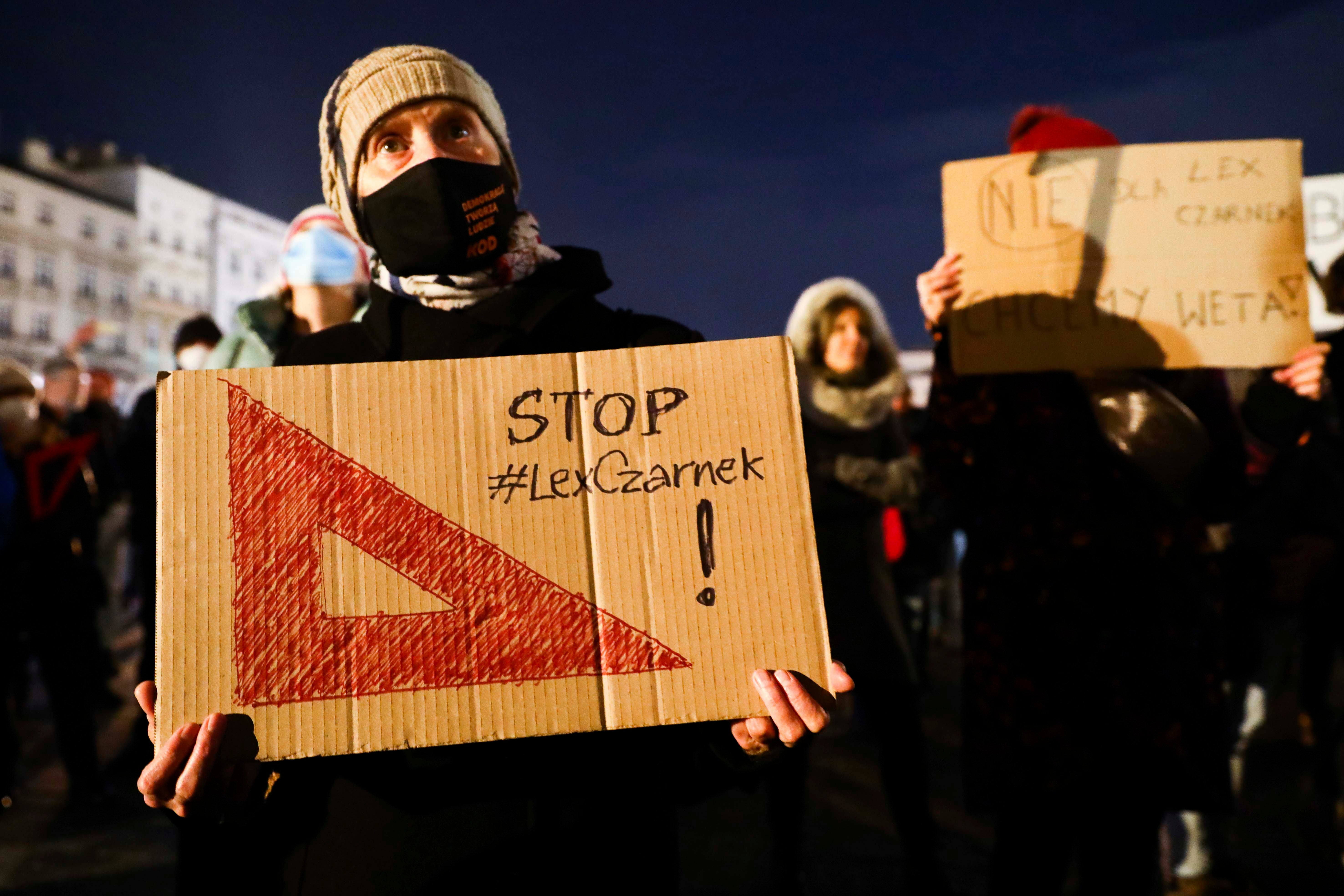 People attend 'Stop Lex Czarnek' protest at the Main Square in Krakow, Poland on February 15, 2022.