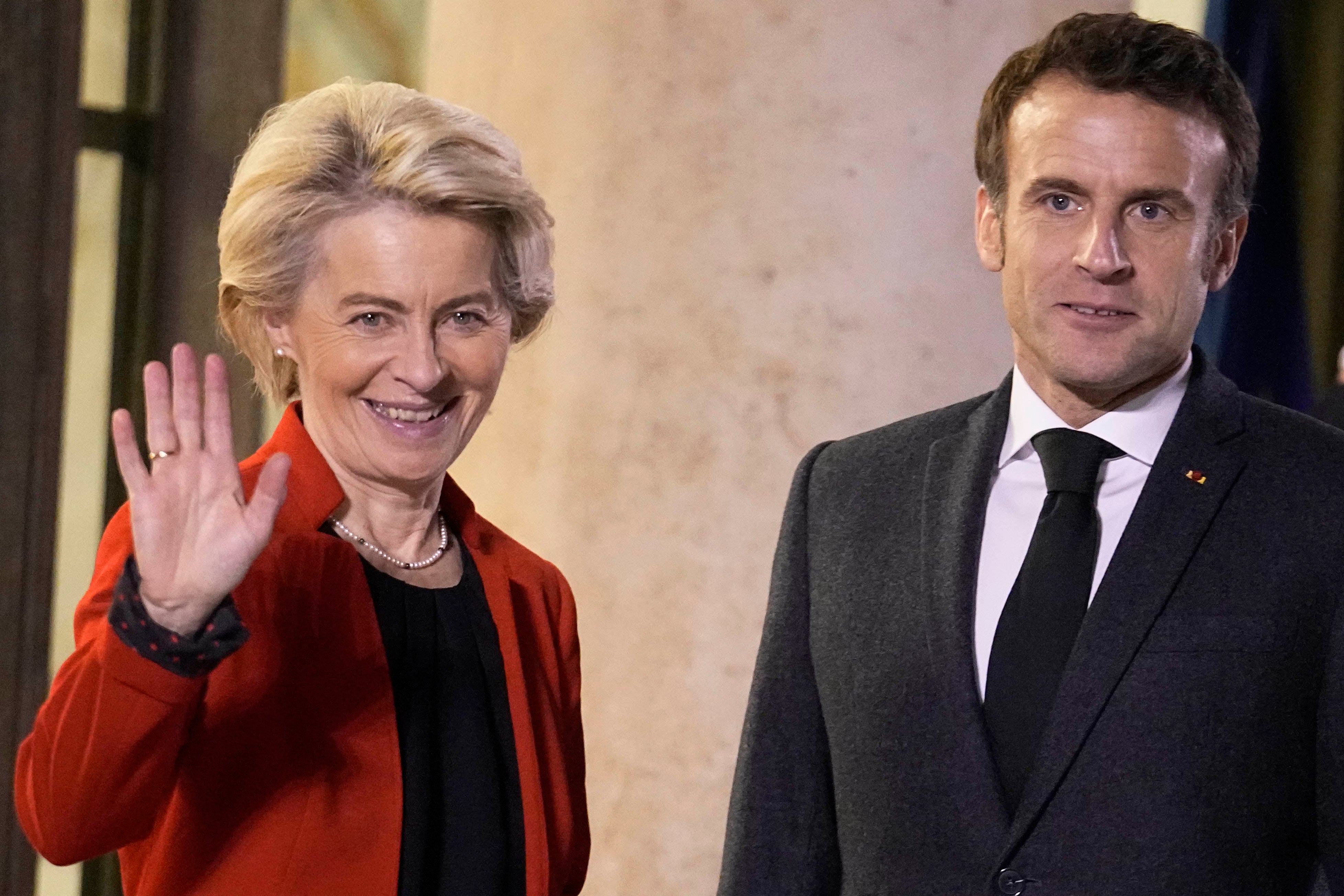 France's President Emmanuel Macron, right, welcomes European Commission President Ursula von der Leyen, at the Elysee Palace, in Paris, December 12, 2022.