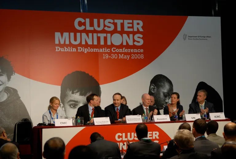 Delegates applaud the adoption of the Convention on Cluster Munitions at the Dublin Diplomatic Conference on May 30, 2008.
