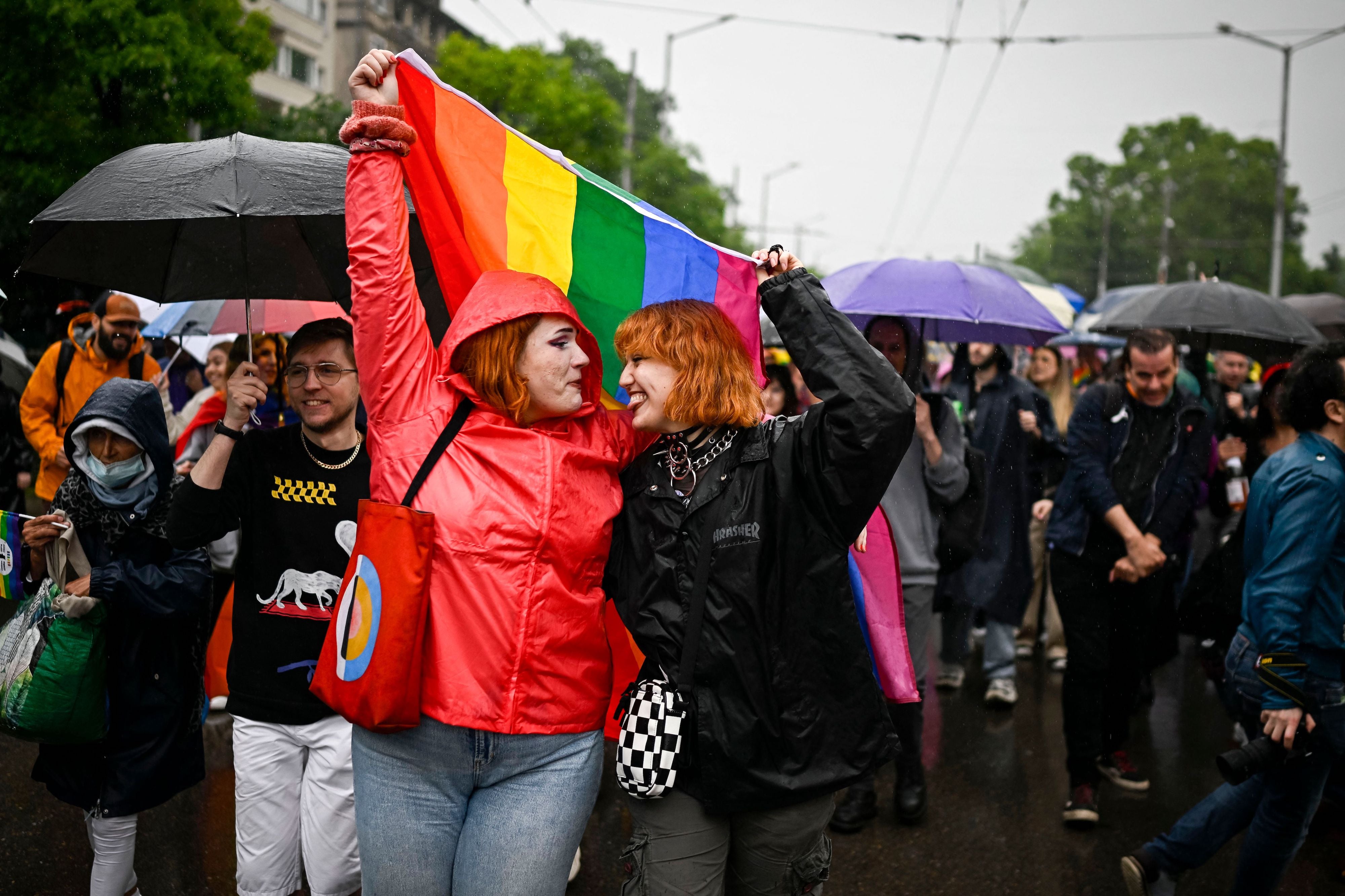 Participants hold a LGBTQI flag as they take part in the annual Gay Pride Parade in downtown Sofia, Bulgaria on June 17, 2023.