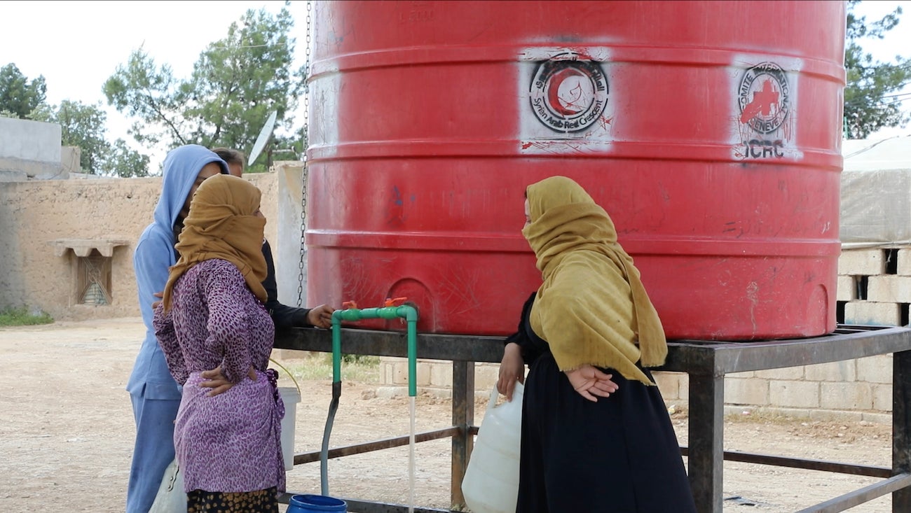  Residents of al-Hasakeh city gather around a communal water tank to fill up Jerry cans and buckets with water for their daily needs as they hardly get any water from the city’s water network due to longstanding water disputes, al-Hasakeh city, northeast Syria, May 8, 2023.