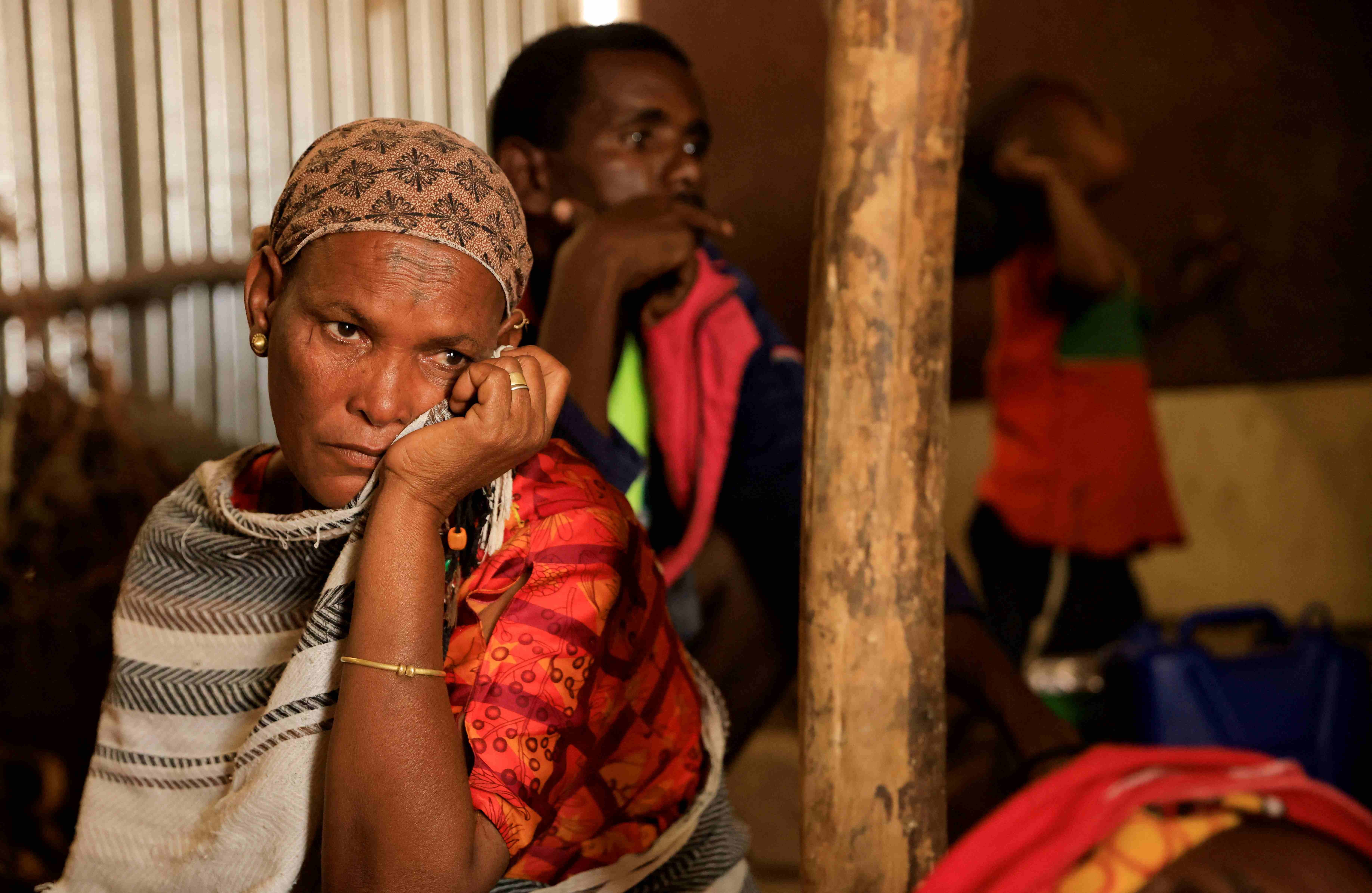 A woman displaced due to the conflict in northern Ethiopia sits in front of her shelter at camp for internally displaced people in Abi Adi, Tigray, June 24, 2023. A woman displaced due to the conflict in northern Ethiopia sits in front of her shelter at camp for internally displaced people in Abi Adi, Tigray, June 24, 2023. (c) 2023 Tiksa Negeri/Reuters 2023 Tiksa Negeri/Reuters
