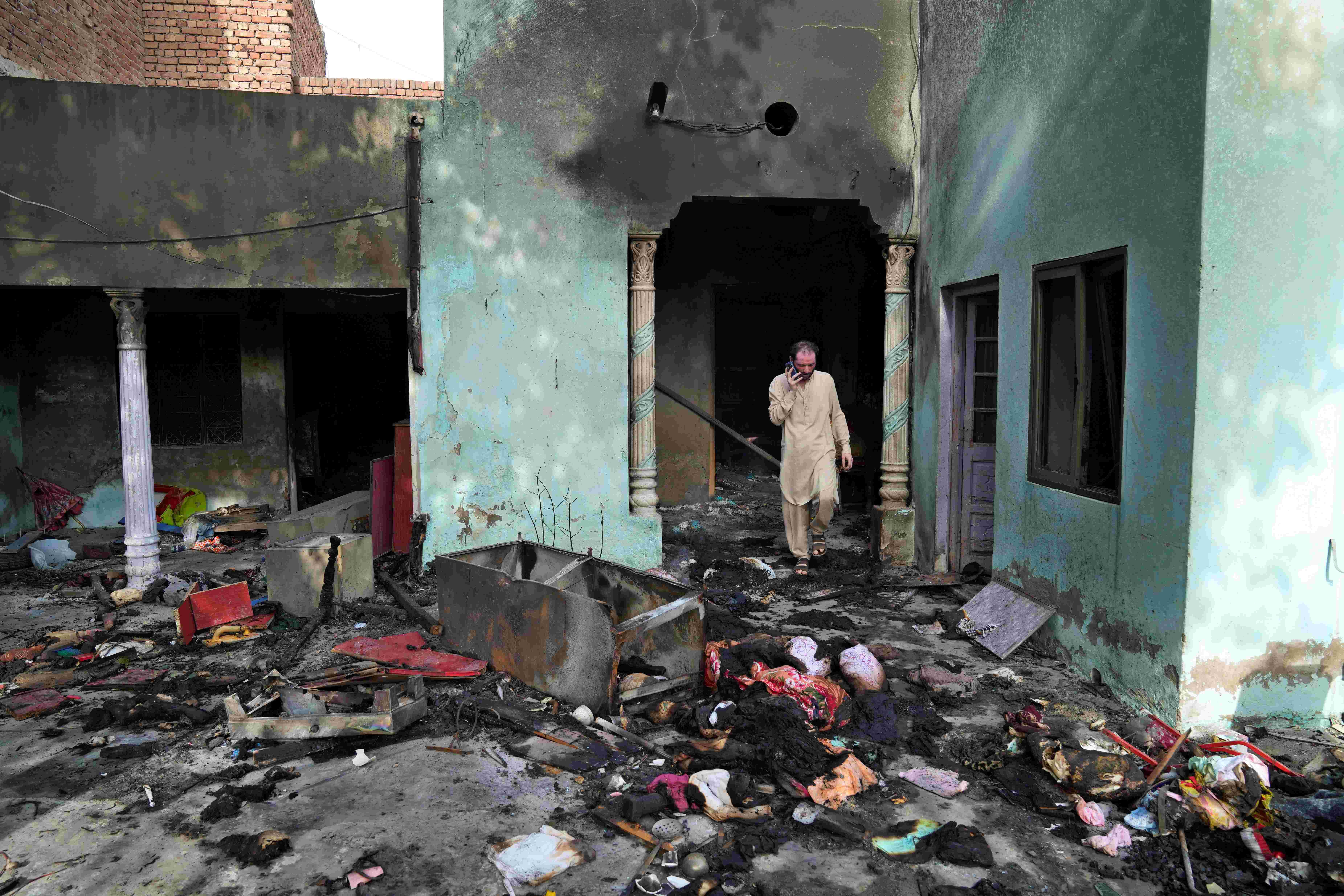 A Christian man looks at a home vandalized by a Muslim mob in Jaranwala, Pakistan, August 17, 2023.