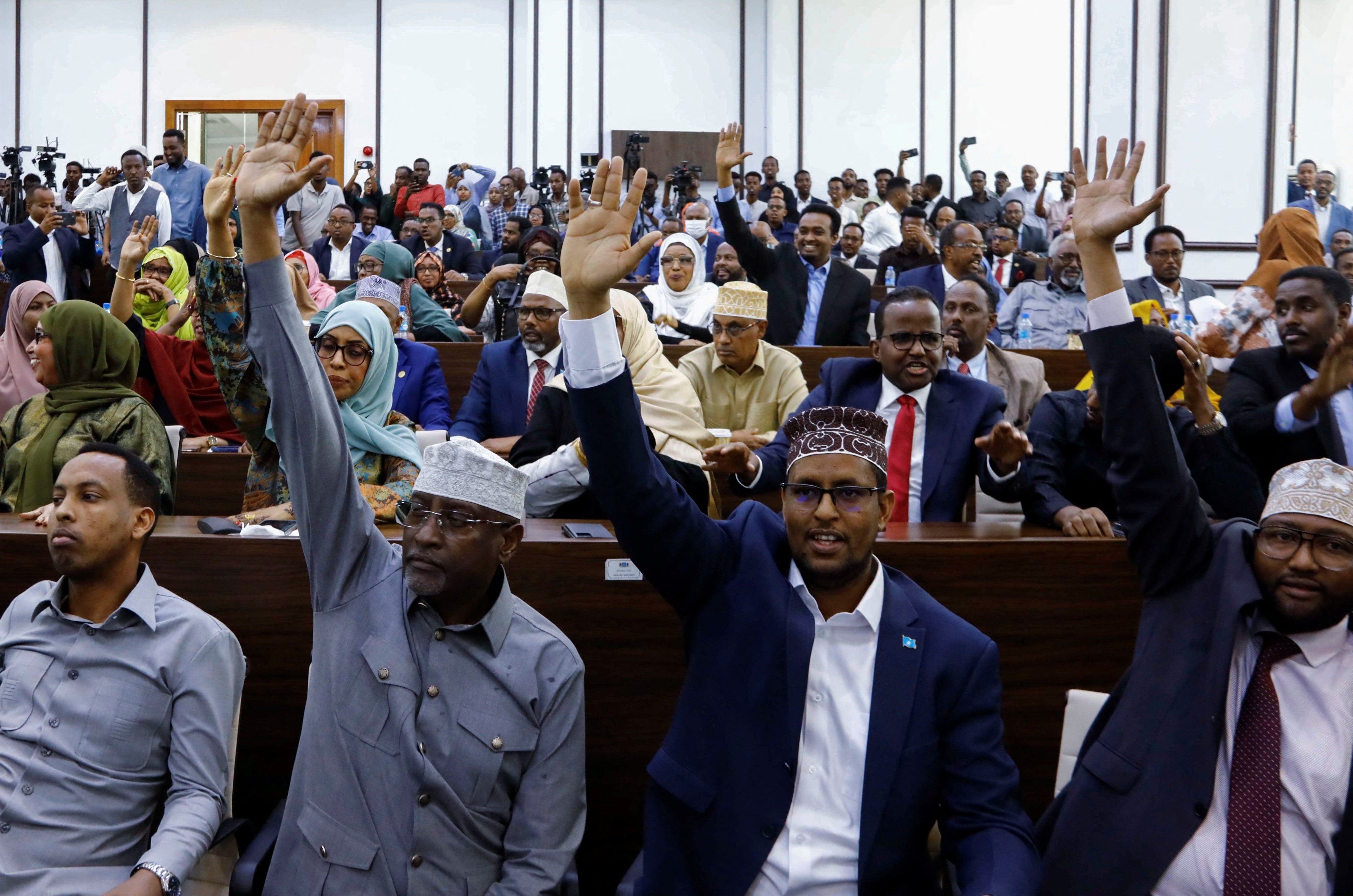 Somali members of Parliament vote on a resolution on the procedural rules for constitutional amendments, Mogadishu, Somalia, January 24, 2024.