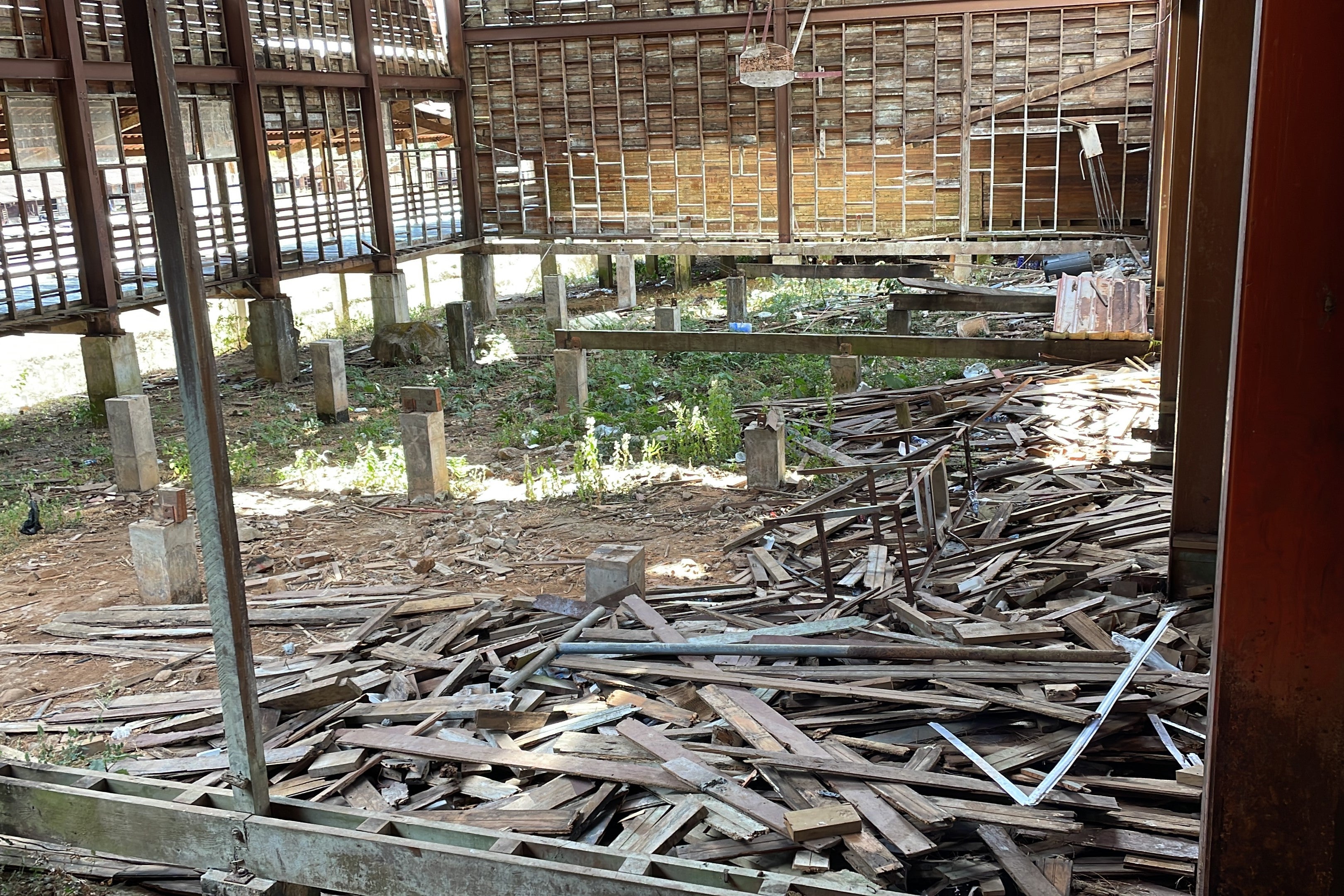 Debris from the collapsed structure of the migrant reception station of Planes de Gualaca, Panama, litter the ground