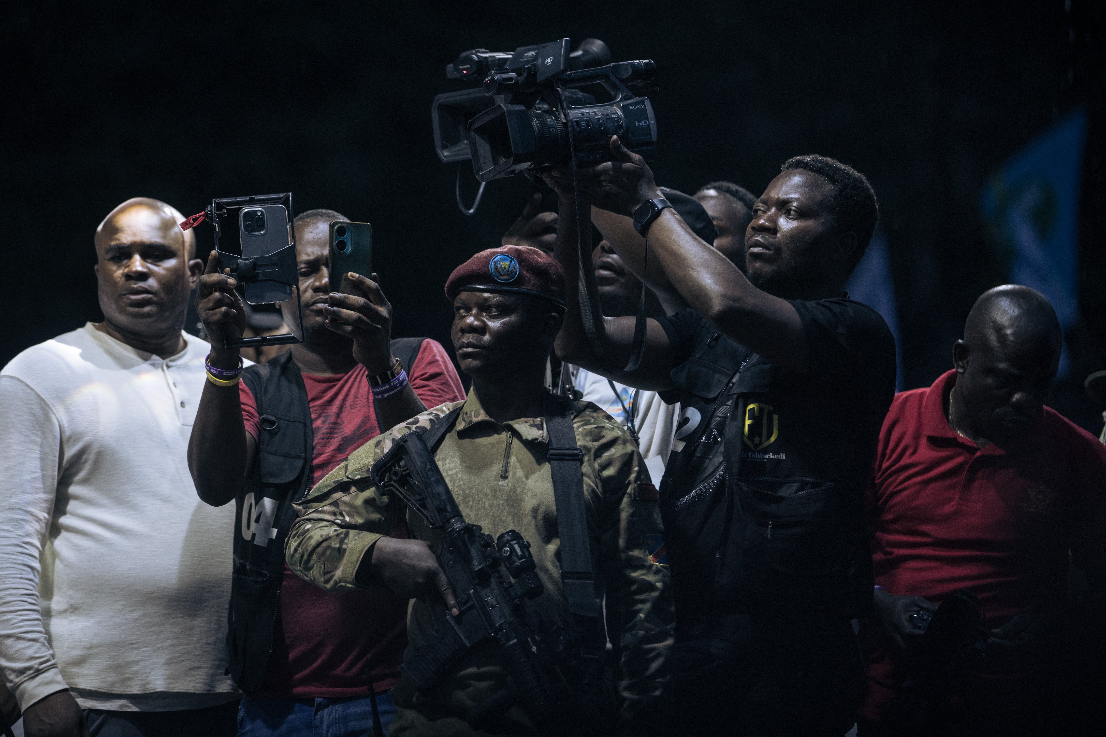 Journalists attend an election rally for president President Felix Tshisekedi in Goma, North Kivu province, Democratic Republic of Congo, on December 10, 2023.