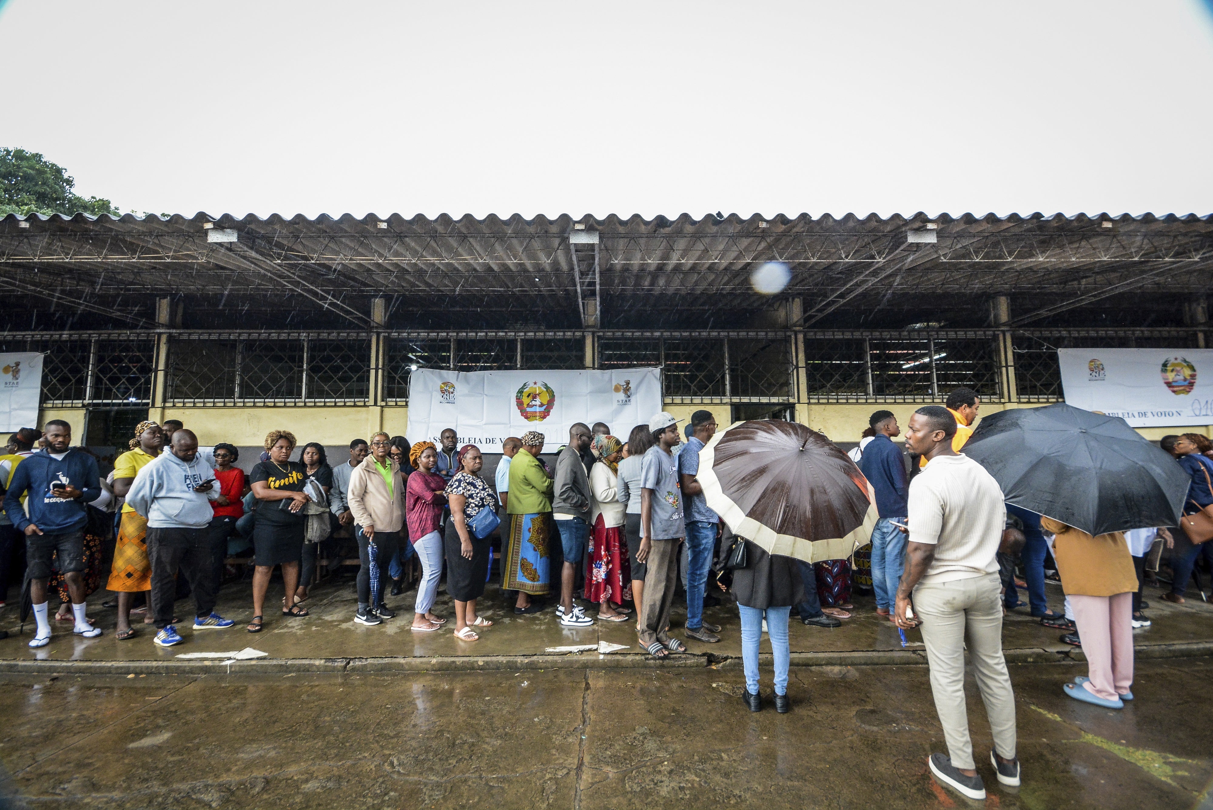 People wait to cast their votes at a polling station for the general elections, Maputo, Mozambique, October 9, 2024. 