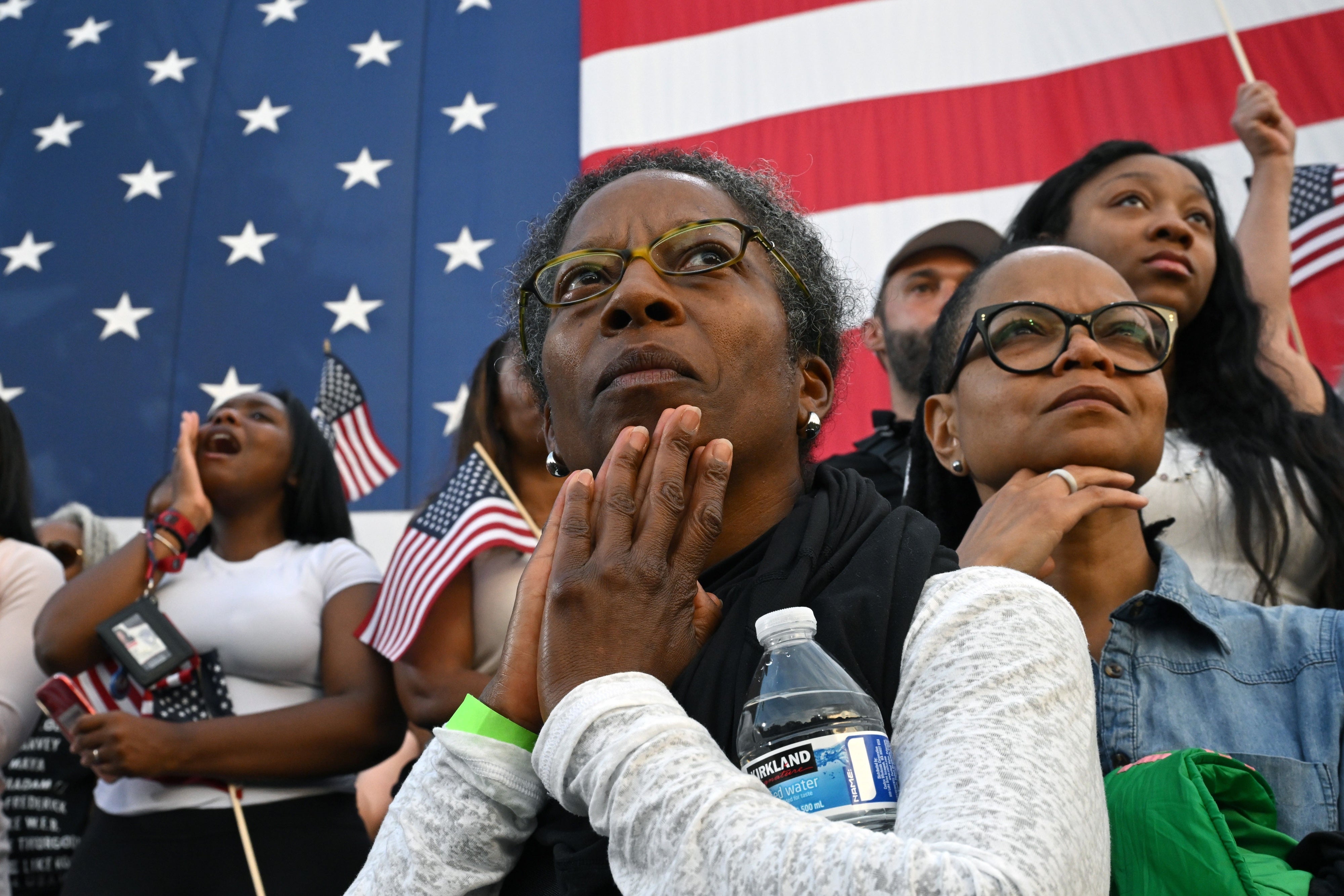 Supporters listen as Vice President Kamala Harris concedes the election