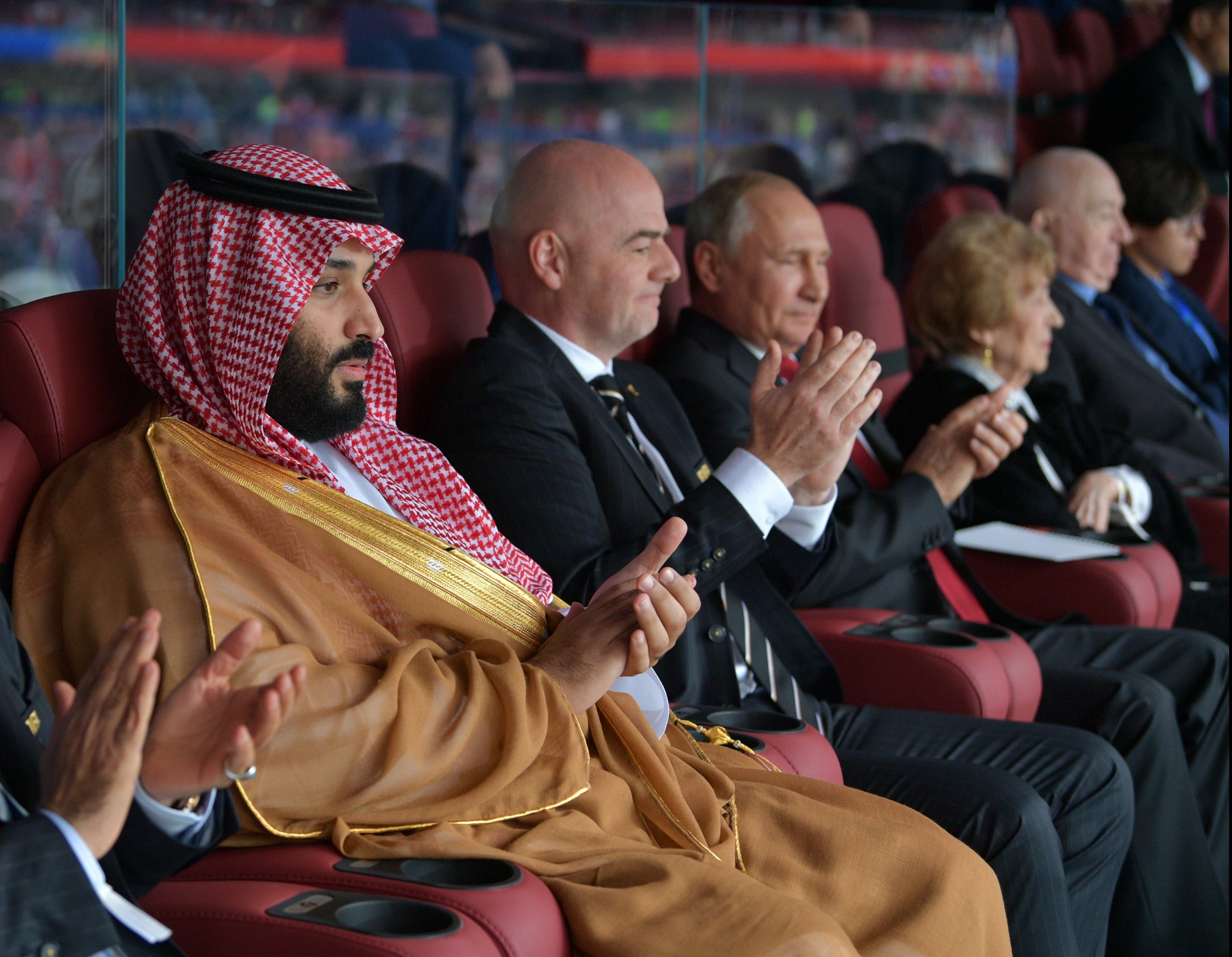 Saudi Crown Prince Mohammed bin Salman (L), FIFA President Gianni Infantino (C) and Russian President Vladimir Putin at 2018 World Cup in Moscow, June 14, 2018.