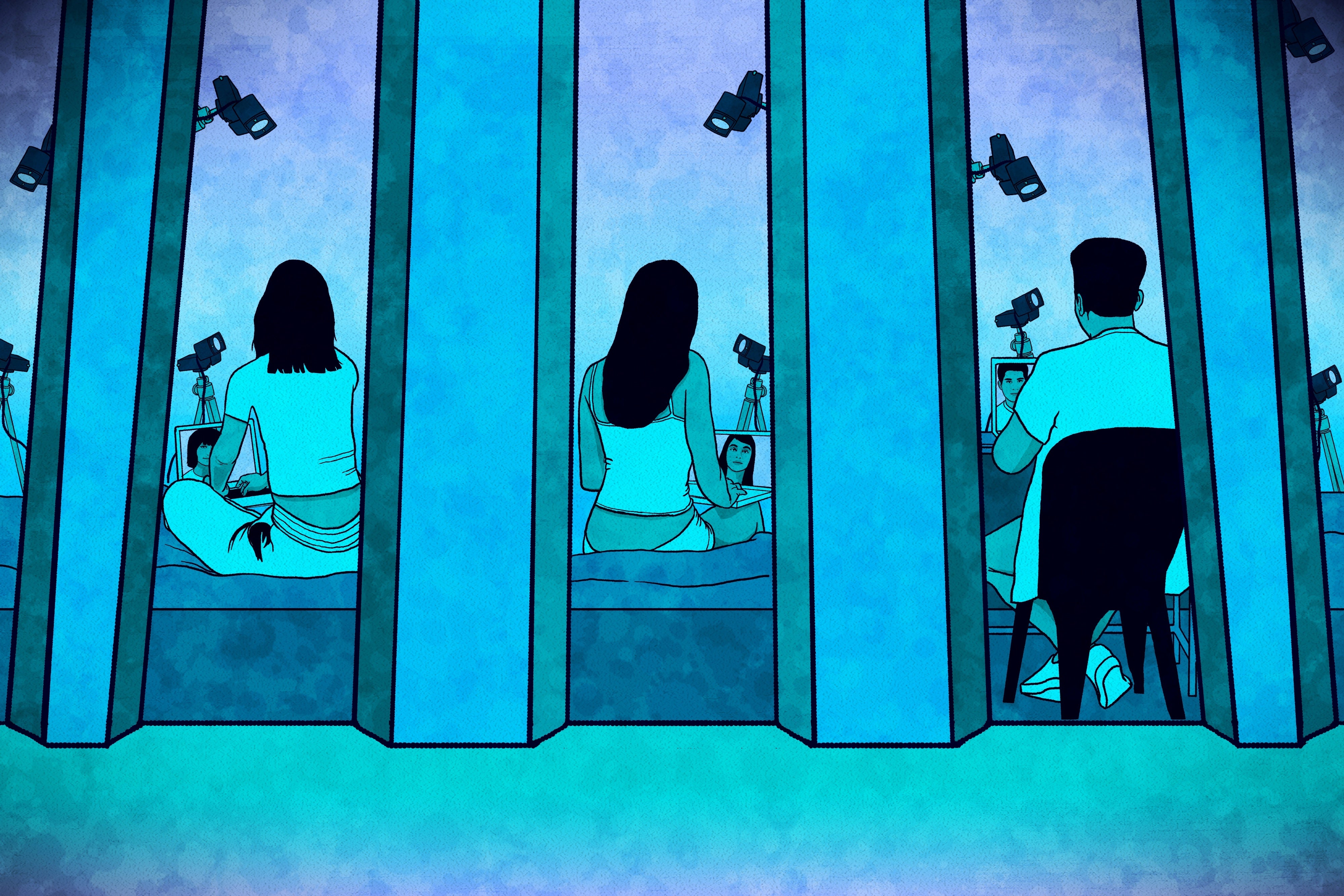 Webcam models seated in cubicles in a studio