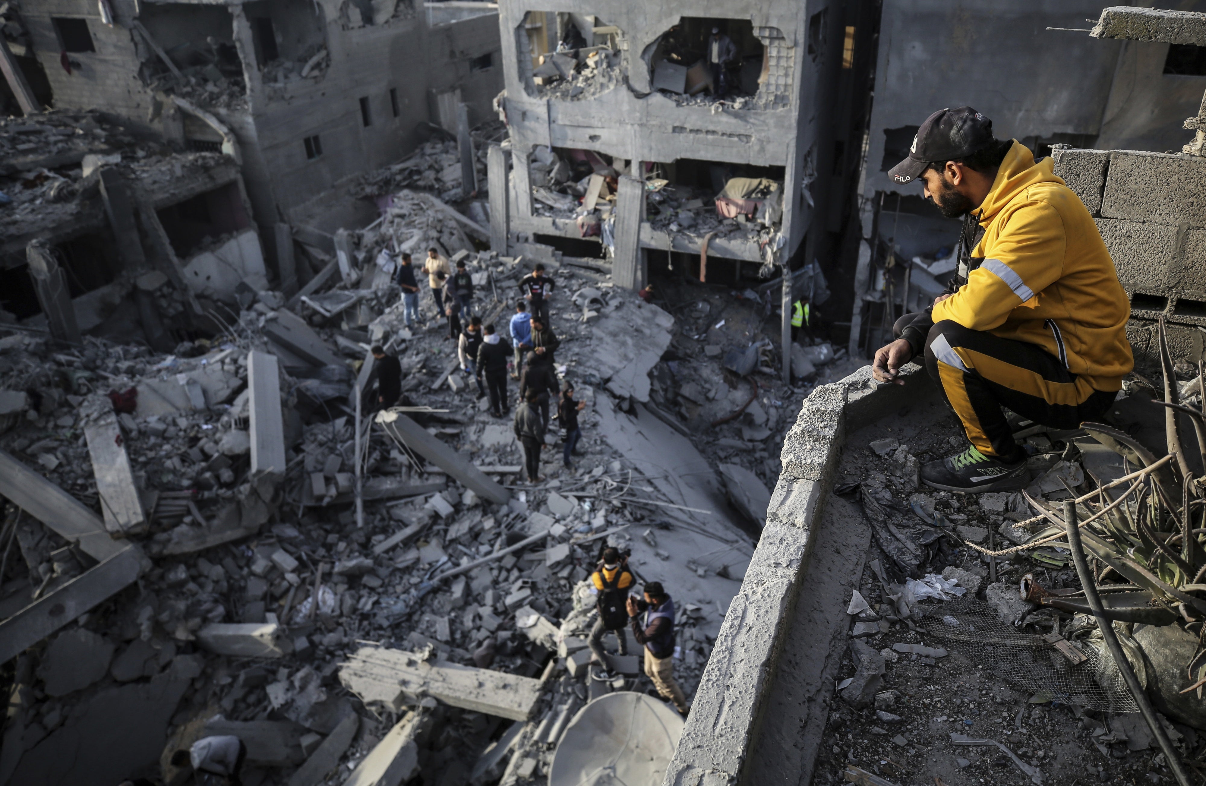 Palestinians inspect the damage after an Israeli strike on the Nuseirat refugee camp in the central Gaza Strip on December 7, 2024.