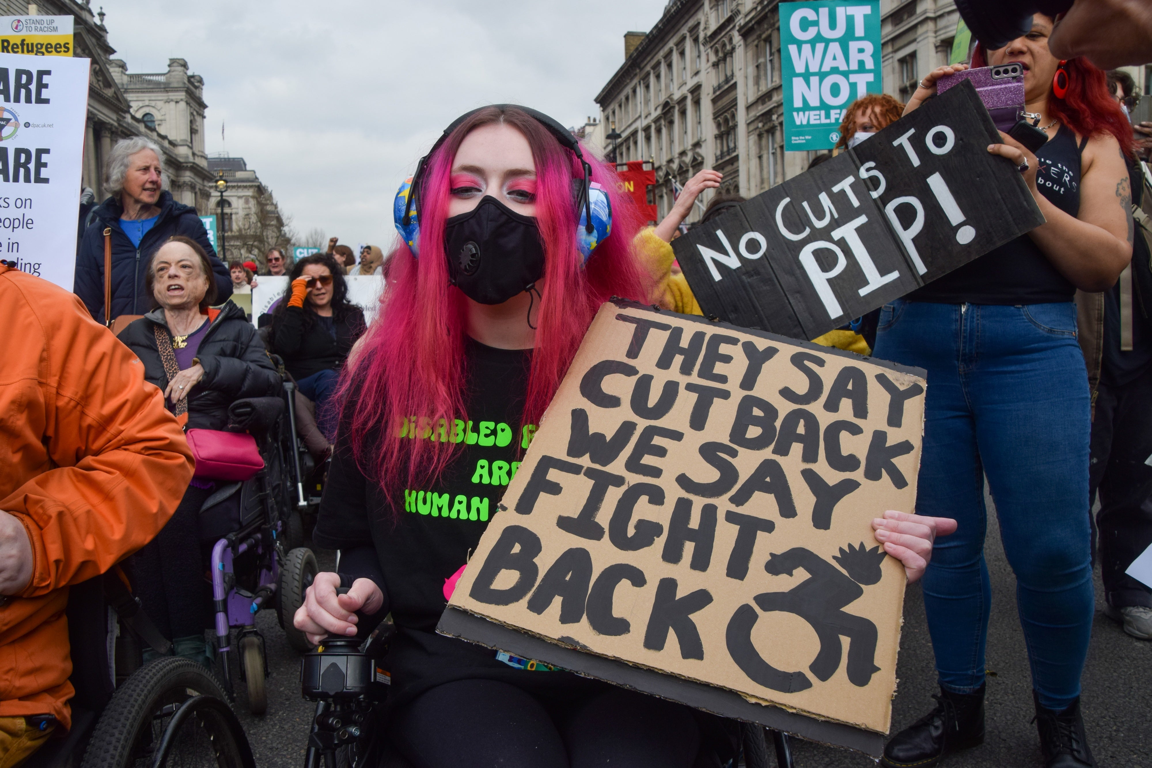 Disability rights activists march in London against social security cuts as the UK’s Chancellor Rachel Reeves presents her “Spring Statement” or mini-budget, March 26, 2025. 