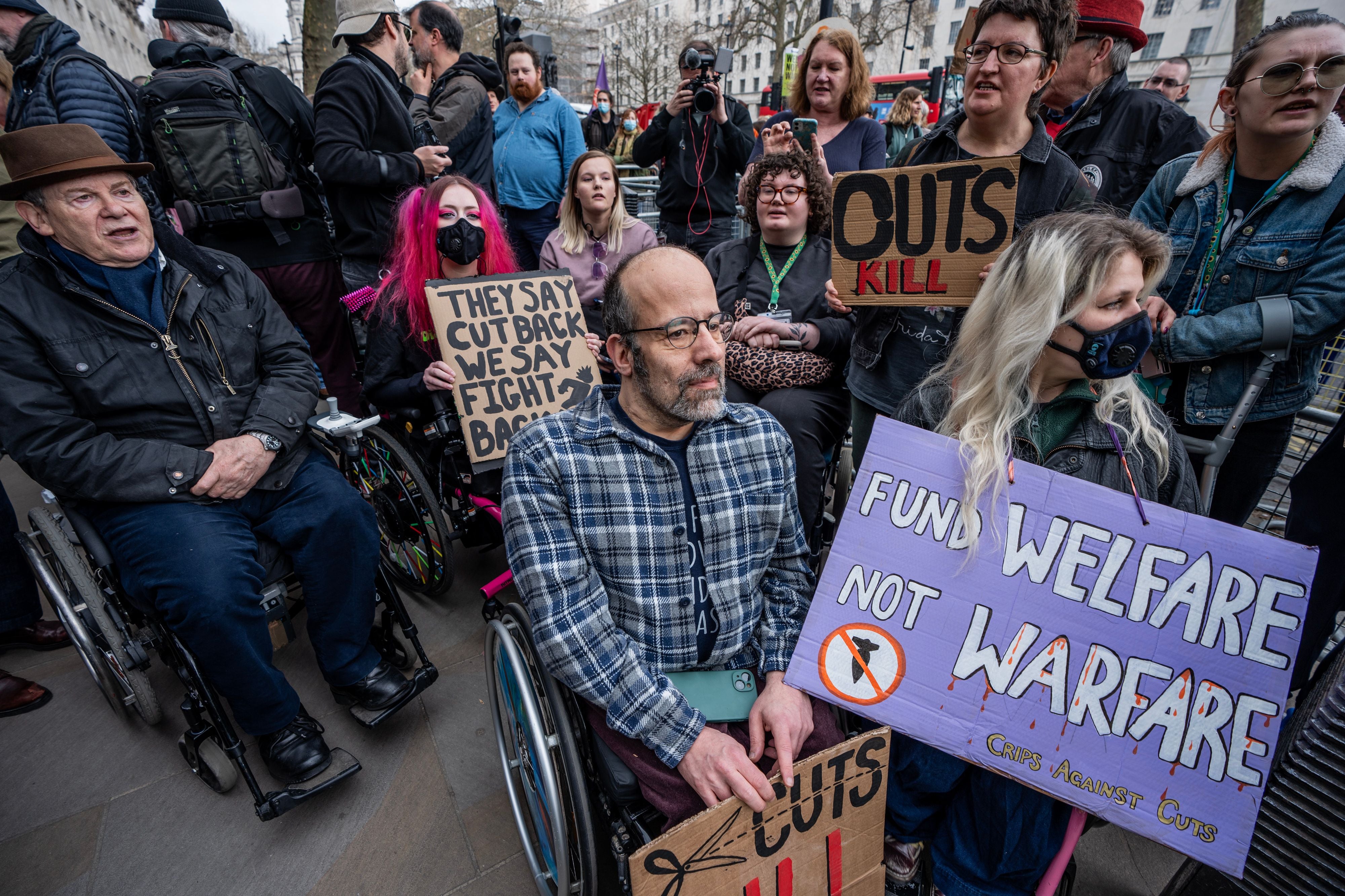 Disability rights activists gather to protest against cuts to social security outside Downing Street, London, UK, March 26, 2025.