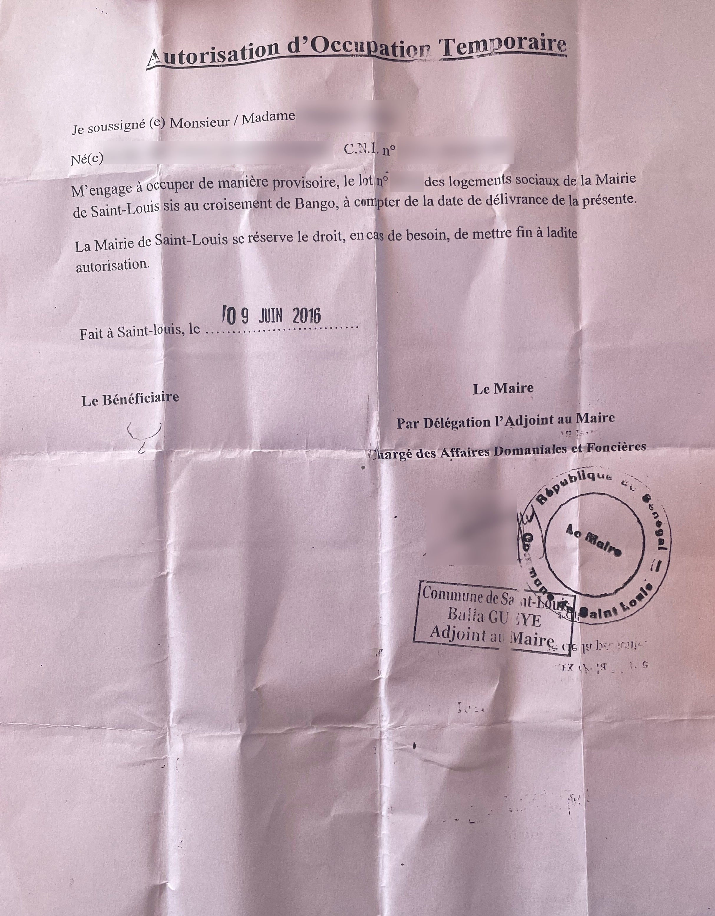 photo of a document with redacted information