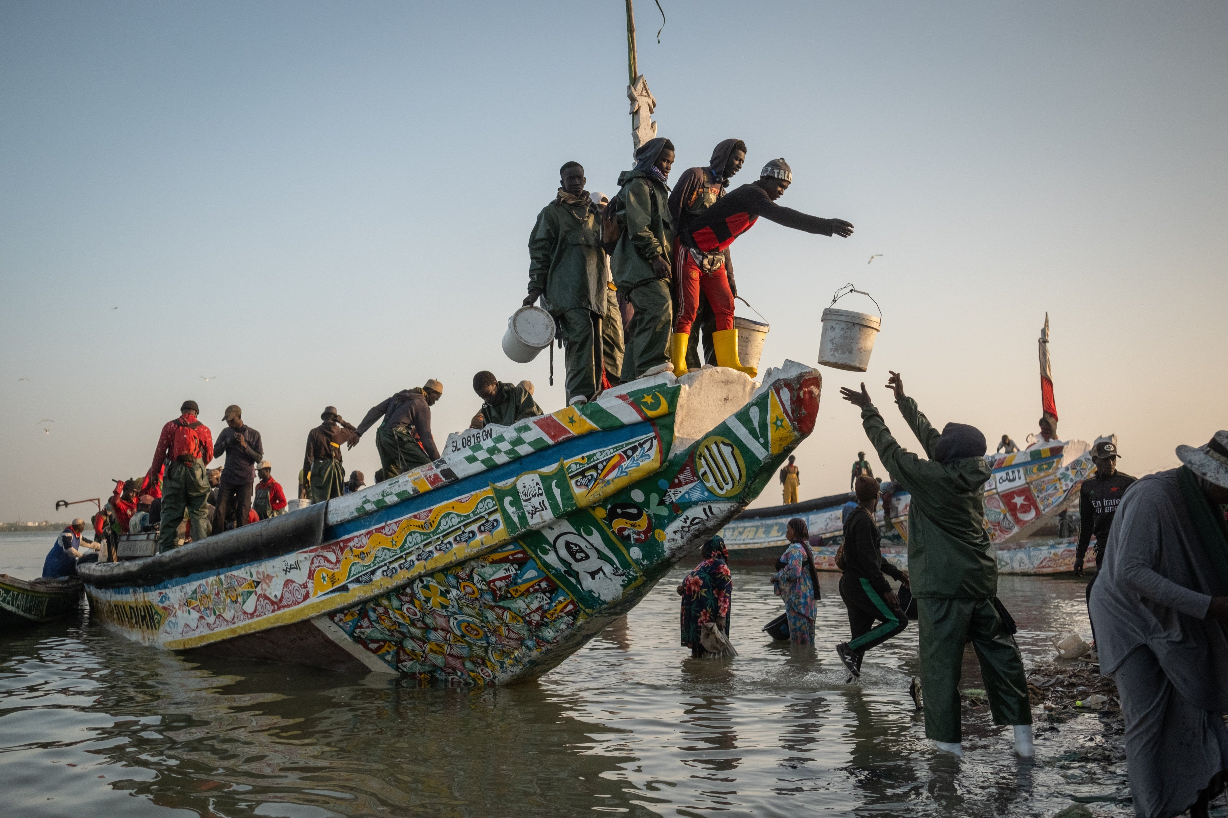 Fisherfolk working on a boat