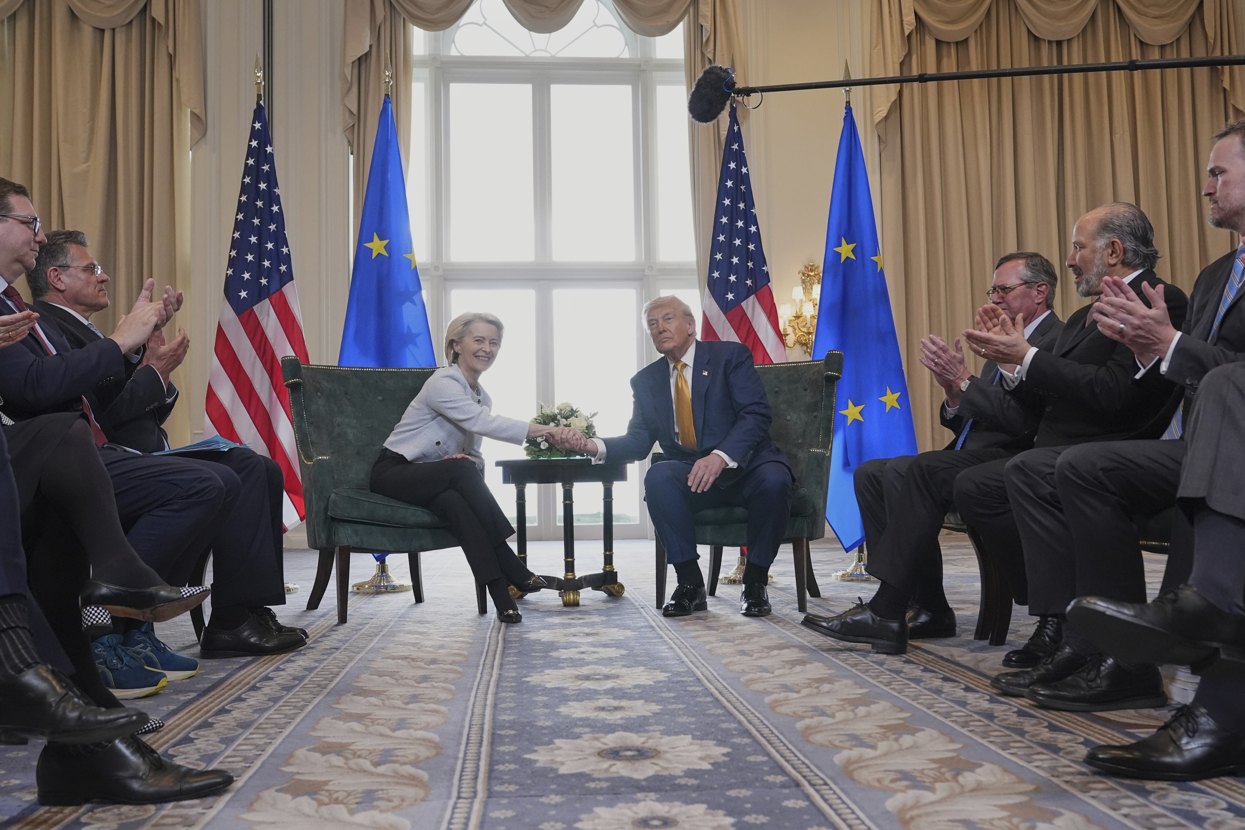 European Commission President Ursula von der Leyen (L) and US President Donald Trump shake hands after reaching a trade deal in Turnberry, Scotland, July 27, 2025. 