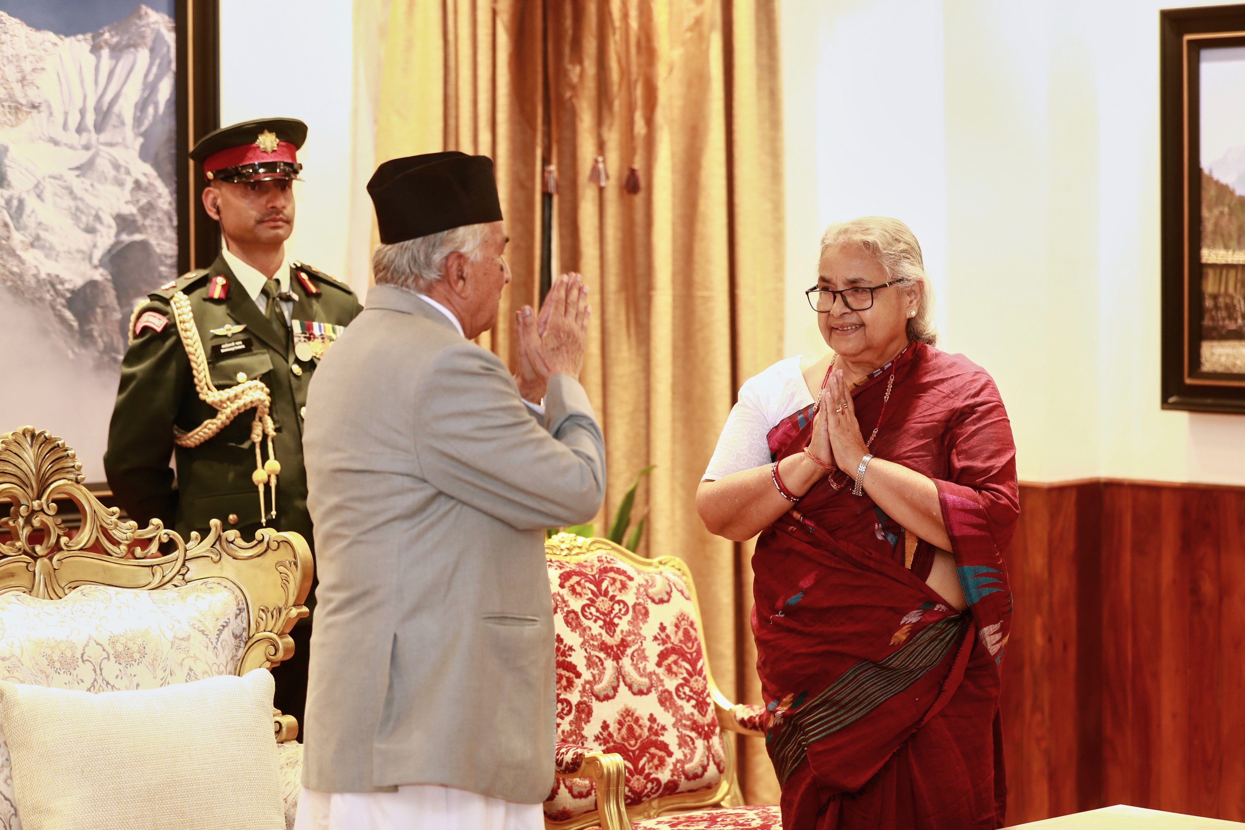 Former Supreme Court Chief Justice Sushila Karki greets President Ram Chandra Poudel after taking the oath as interim prime in Kathmandu, September 12, 2025.