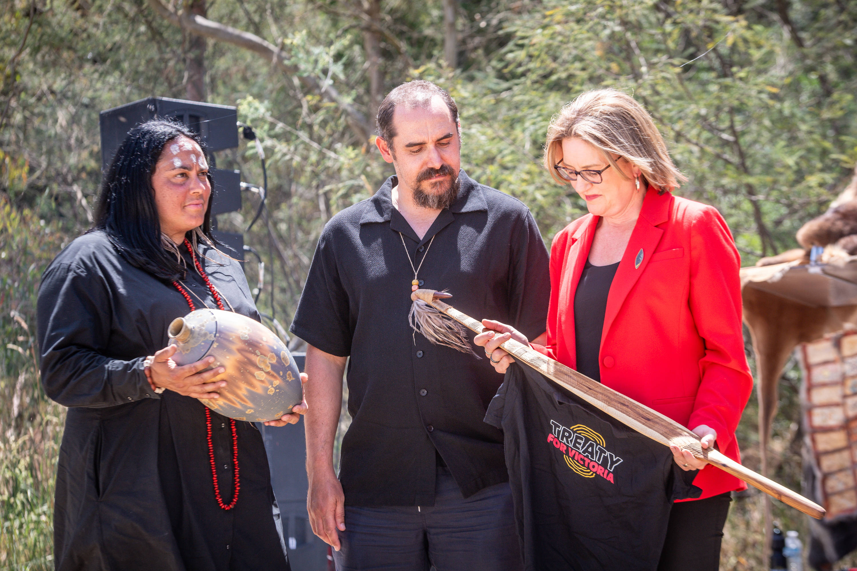 First Peoples Assembly co-chairs Ngarra Murray, left, and Ruben Berg, center, exchange gifts with Victorian Premier Jacinta Allan during the Ceremonial Opening of Treaty Negotiations on Wurundjeri Woi-wurrung country at Darebin Parklands, Victoria, Australia, November 21, 2024. 