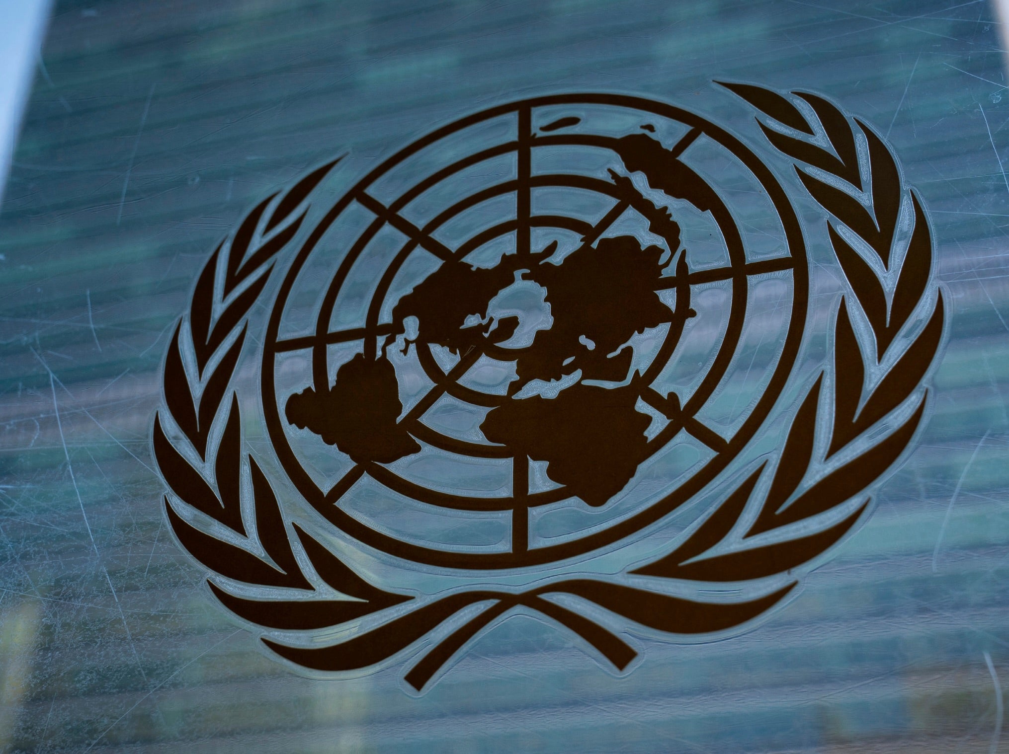 United Nations logo etched on glass