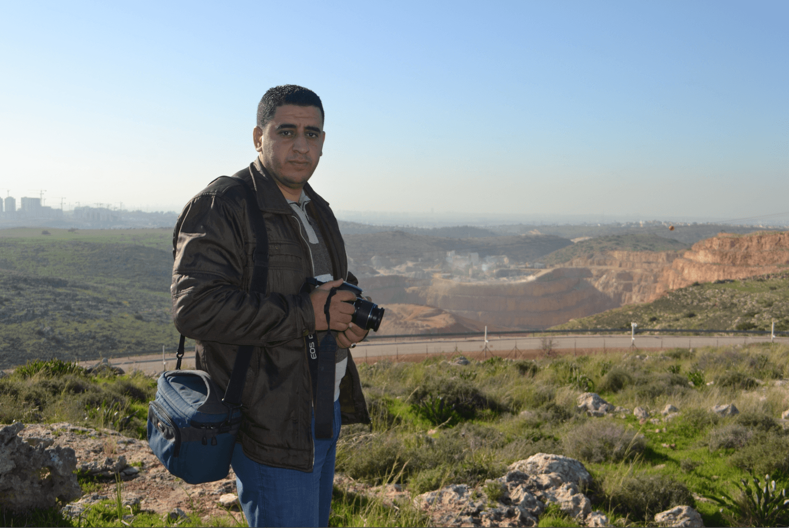 Azmi Shuqeir, of the West Bank village of Zawiya, in front of a quarry that a multinational company operates on land confiscated by Israel. 