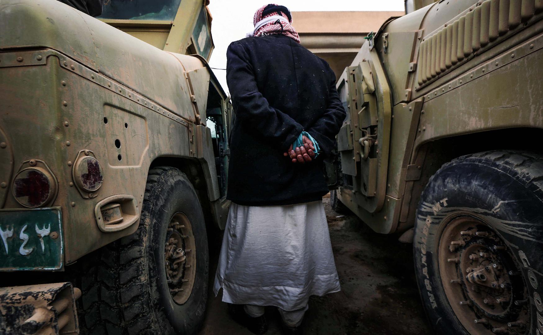 An ISIS suspect held for questioning by Iraqi forces near Mosul.