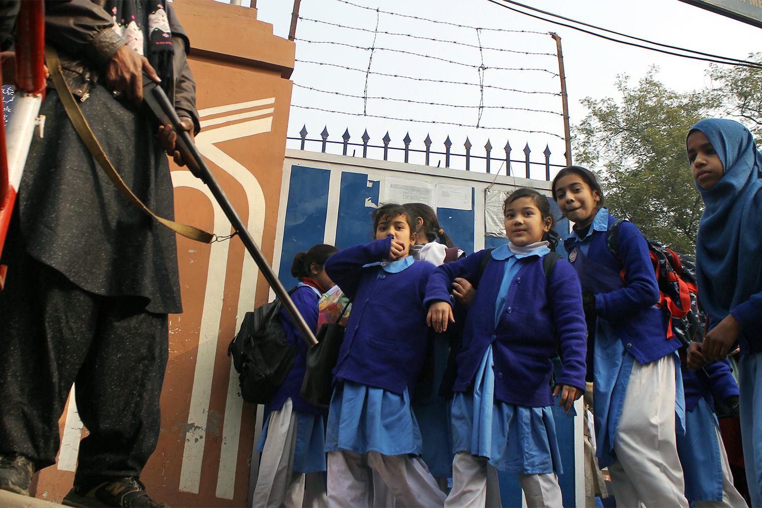 Pakistani students in Lahore return to school under high alert security after the December 16, 2014 attack by the Pakistani Taliban on the Army Public School in Peshawar, January 1, 2015.