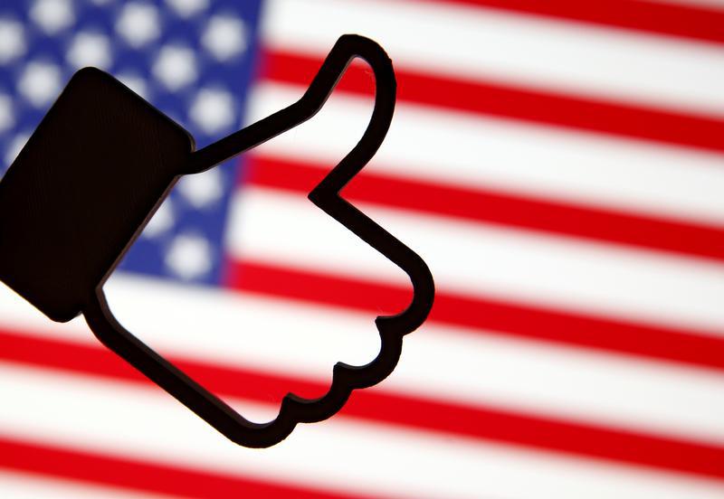 A 3D-printed Facebook Like symbol is displayed in front of a U.S. flag in this illustration taken, March 18, 2018.