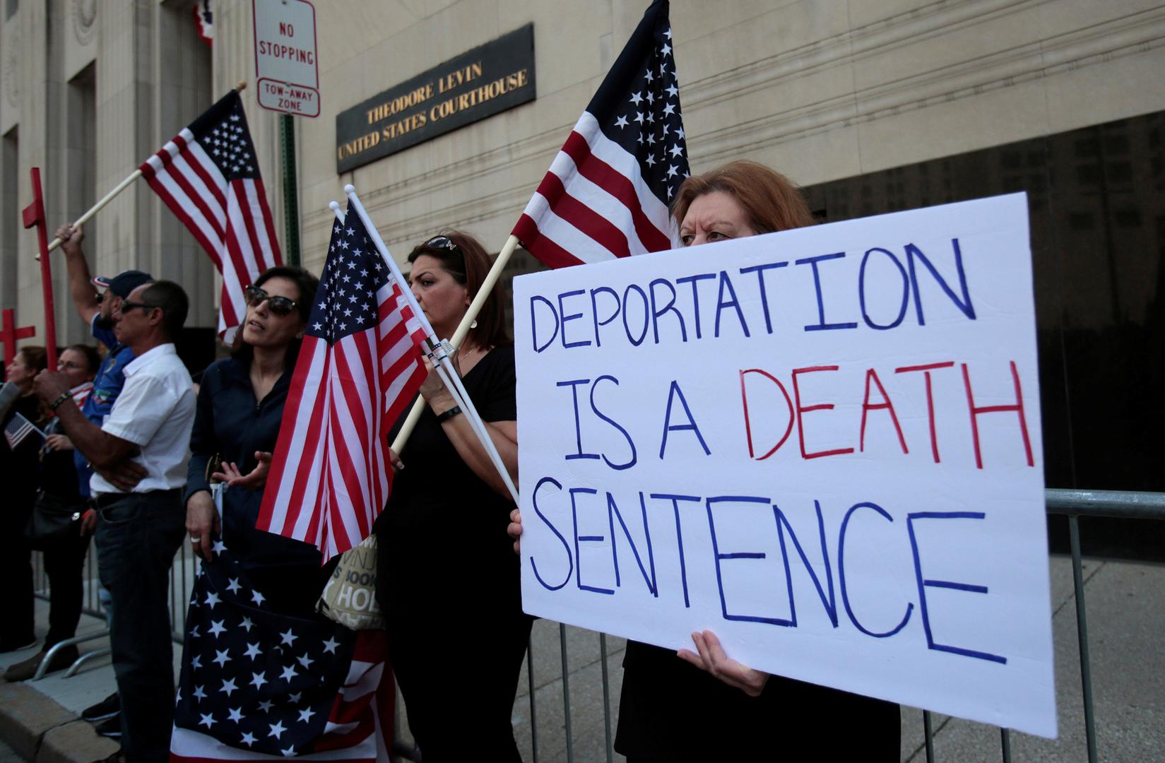 Protesters rally outside the federal court just before a hearing to consider a class-action lawsuit filed on behalf of Iraqi nationals facing deportation, in Detroit, Michigan, US, June 21, 2017. © 2017 Reuters/Rebecca Cook