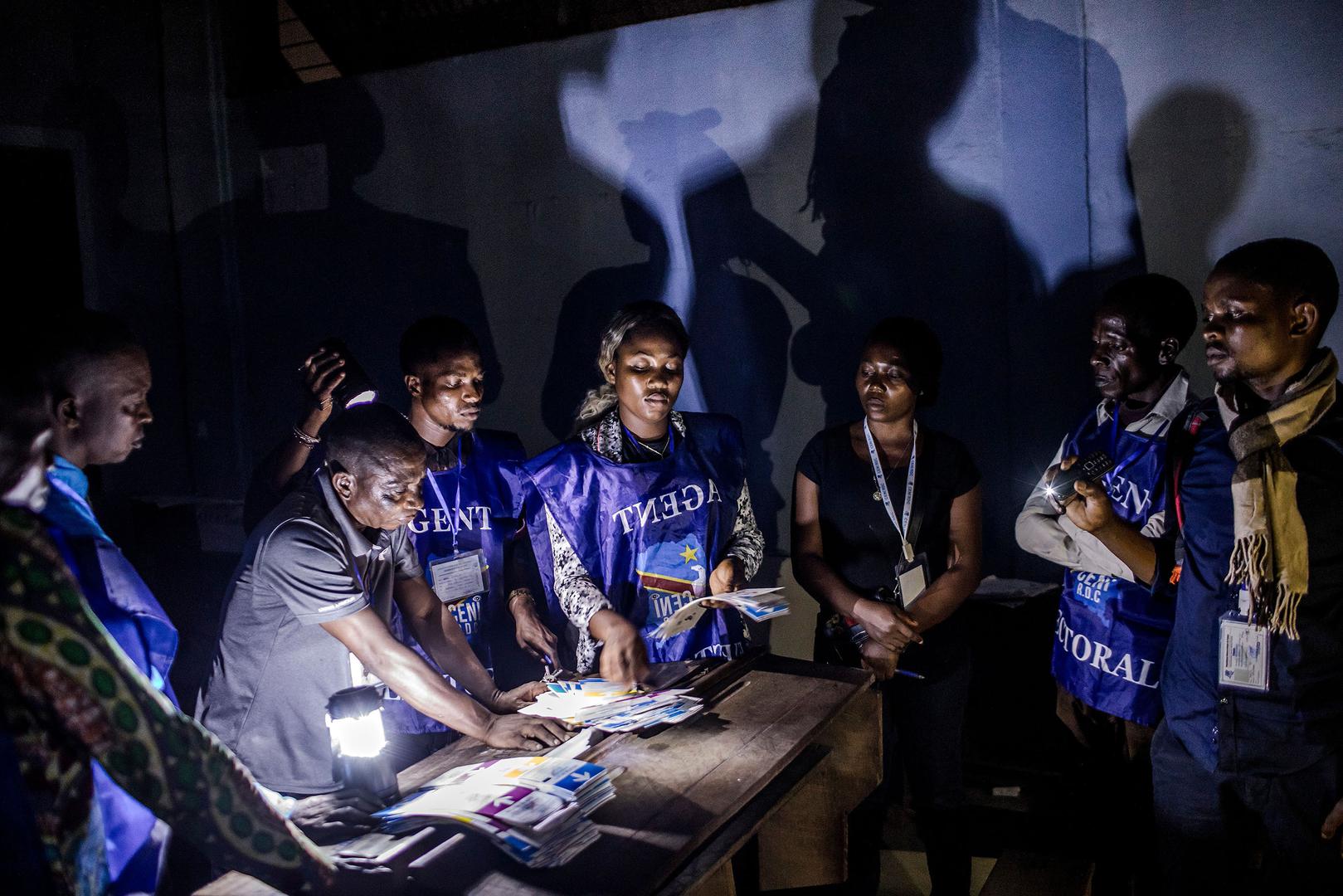 A polling official counts votes in a school in Kinshasa after the Democratic Republic of Congo’s general elections, December 30, 2018.