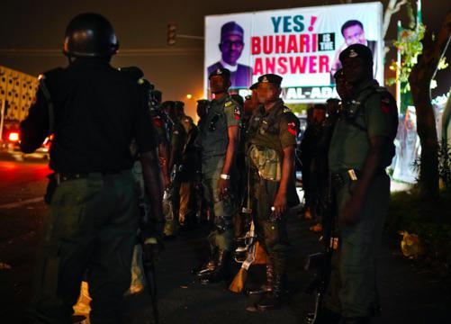 Nigeria’s military guard the campaign headquarters of President Muhammadu Buhari in Abuja, Nigeria,Feb. 25, 2019. © AP Photo/Jerome Delay