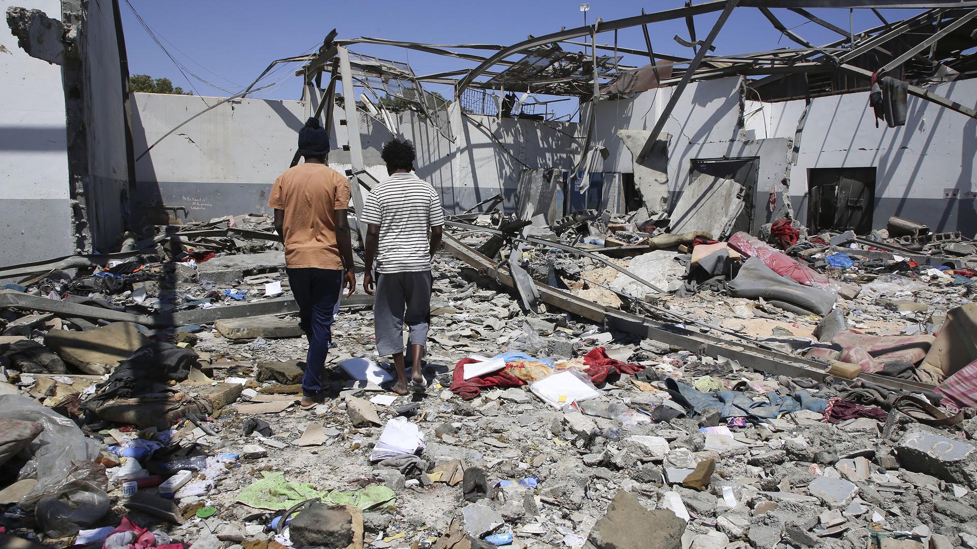 Debris covers the ground after an airstrike at a detention center in Tajoura, east of Tripoli in Libya, Wednesday, July 3, 2019. 
