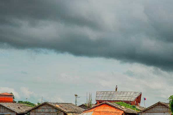 A Rohingya refugee man stands on a makeshift house at the Kutupalong refugee camp in Ukhia on Setember 13, 2019. (Photo by MUNIR UZ ZAMAN / AFP) (Photo credit should read MUNIR UZ ZAMAN/AFP/Getty Images)