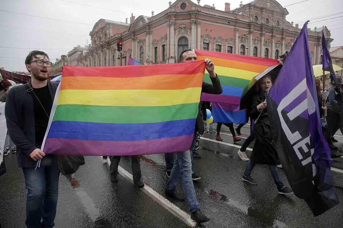 LGBT rights activists carry the rainbow flag during a May Day rally in St. Petersburg, Russia.