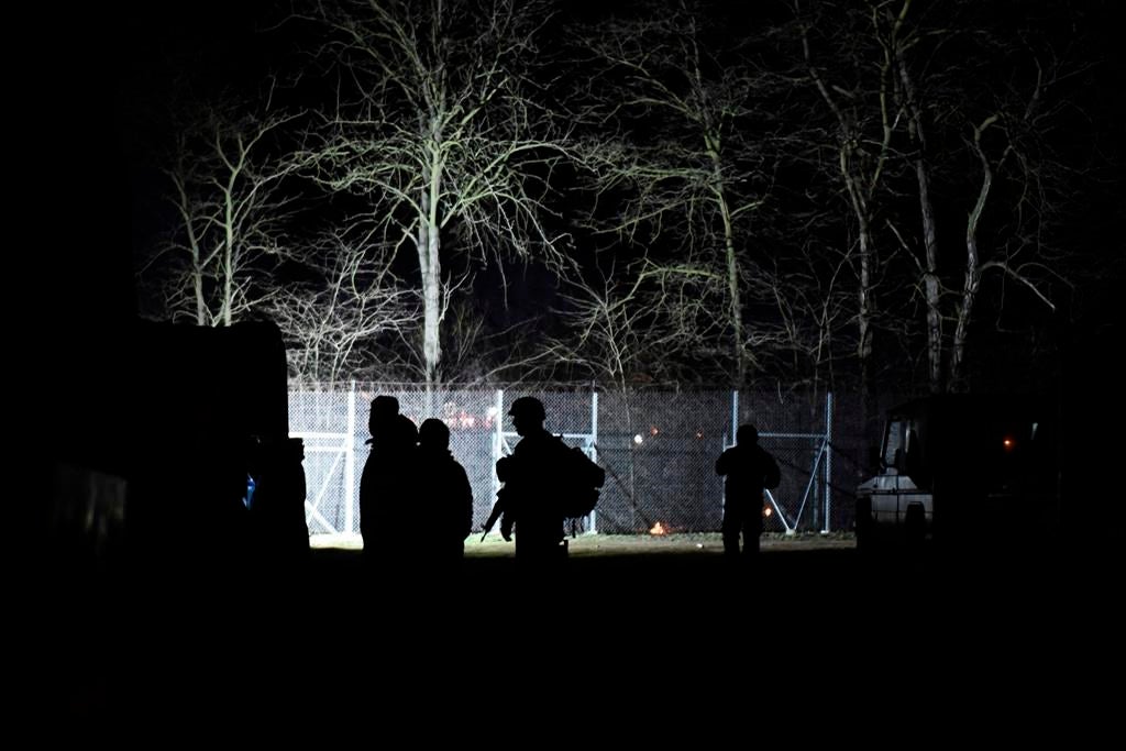 Greek soldiers guard the Kastanies border gate at the Greek-Turkish border, February 29, 2020.