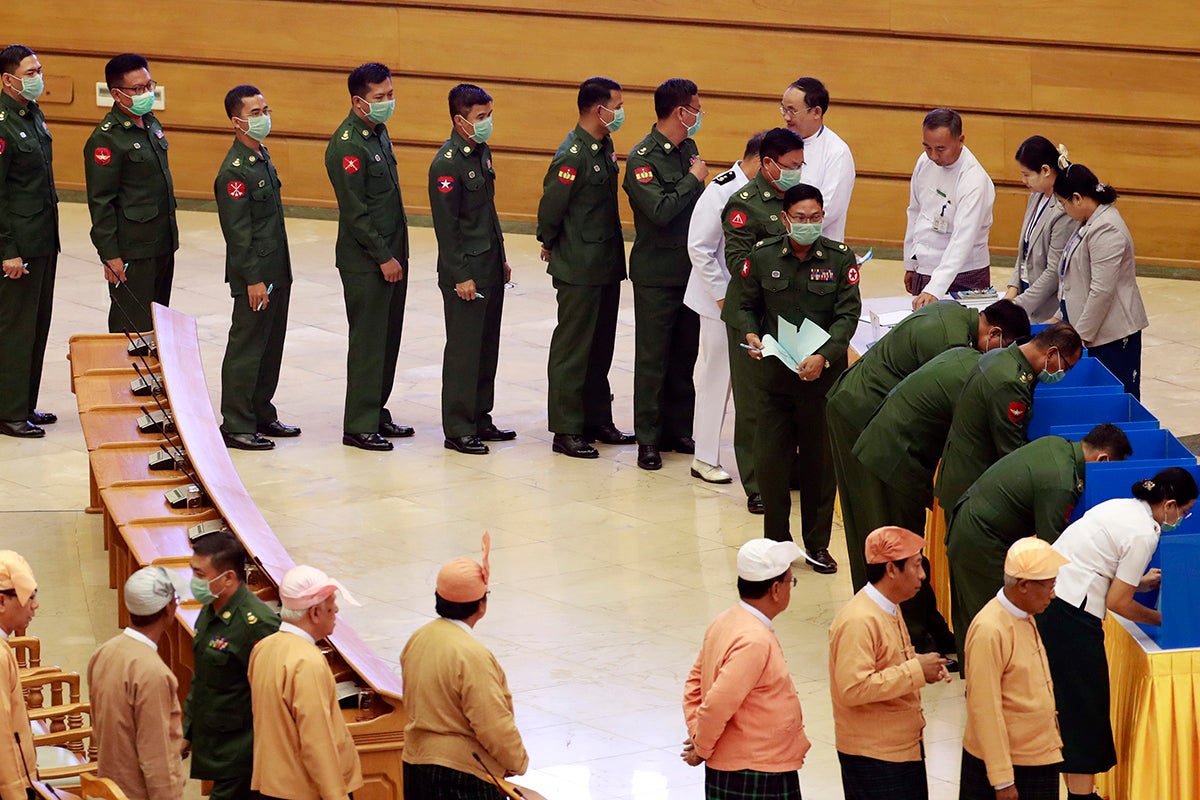Military and civilian members of parliament vote on proposed amendments to the 2008 Constitution, Naypyidaw, March 10, 2020.