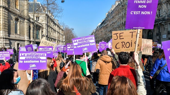 Women demonstrate and march for “First of Chores” on International Day