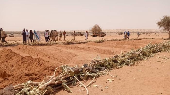 Villagers at a mass grave containing the remains of civilians killed during the March 21, 2021 attack by armed Islamist groups on villages in Tahoua region, Niger. More than 170 Tuareg villagers were killed in the attack, Niger’s worst atrocity in recent history.